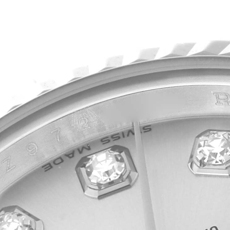 This close-up image shows part of the dial and diamond hour markers of a Rolex Datejust 179174 Women
s Stainless Steel Silver Dial 179174 Women
s Stainless Steel Silver Dial watch.