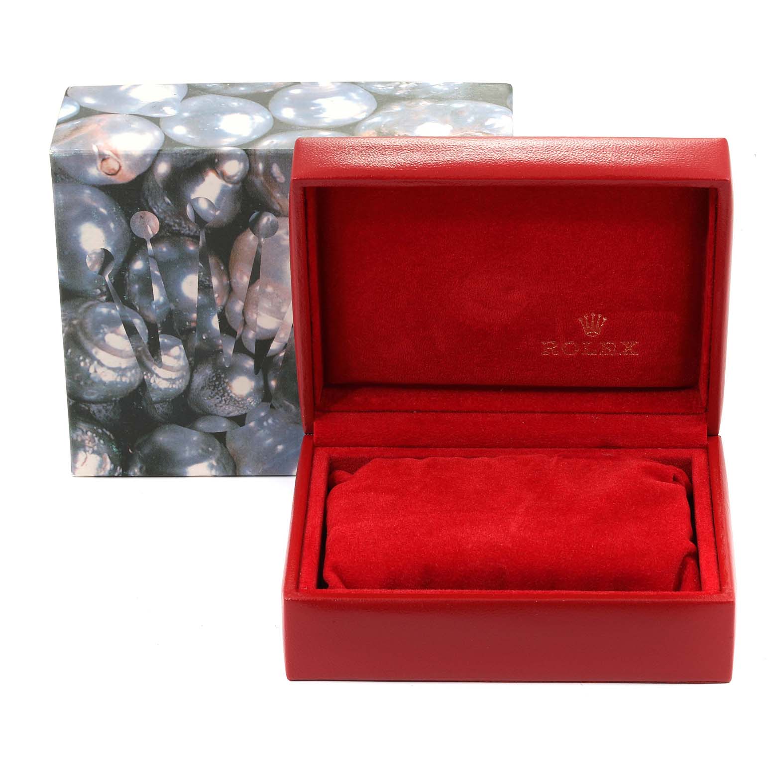 The image shows an open red Rolex watch box with its cushion, designed for a Datejust model, with a decorative outer box in the background.