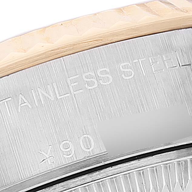 The image shows a close-up of the Rolex Datejust 79173 Women
s Steel and Gold (two tone) Blue Dial 79173 Women
s Steel and Gold (two tone) Blue Dial watch
s case back, highlighting the "STAINLESS STEEL" engraving and part of the bezel.