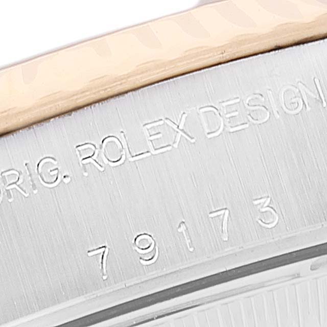 This image shows a detailed, close-up view of the Rolex Datejust 79173 Women
s Steel and Gold (two tone) Mother of Pearl Dial 79173 Women
s Steel and Gold (two tone) Mother of Pearl Dial model
s bezel and case engraving.