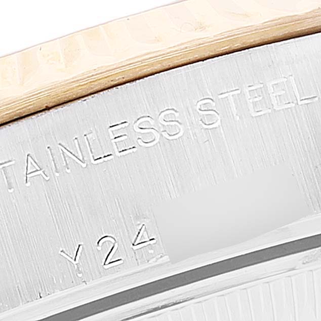 The image shows a close-up of the stainless steel case back of a Rolex Datejust 79173 Women
s Steel and Gold (two tone) Mother of Pearl Dial 79173 Women
s Steel and Gold (two tone) Mother of Pearl Dial watch, displaying part of the serial number.