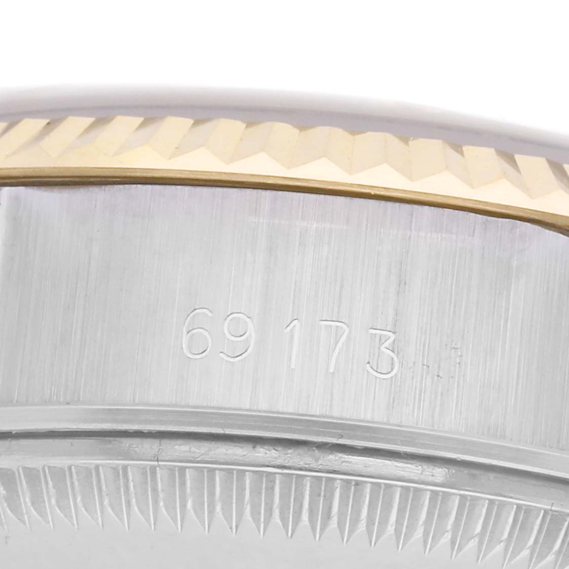 The image shows a close-up of the edge and model number "69173" engraving on the side of a Rolex Datejust watch case.