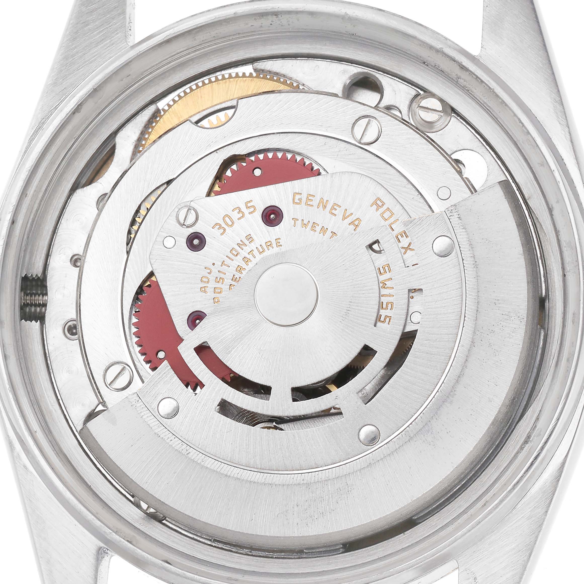 The image shows the movement of a Rolex Datejust model 16013 men's watch from the back, highlighting its intricate mechanical components.