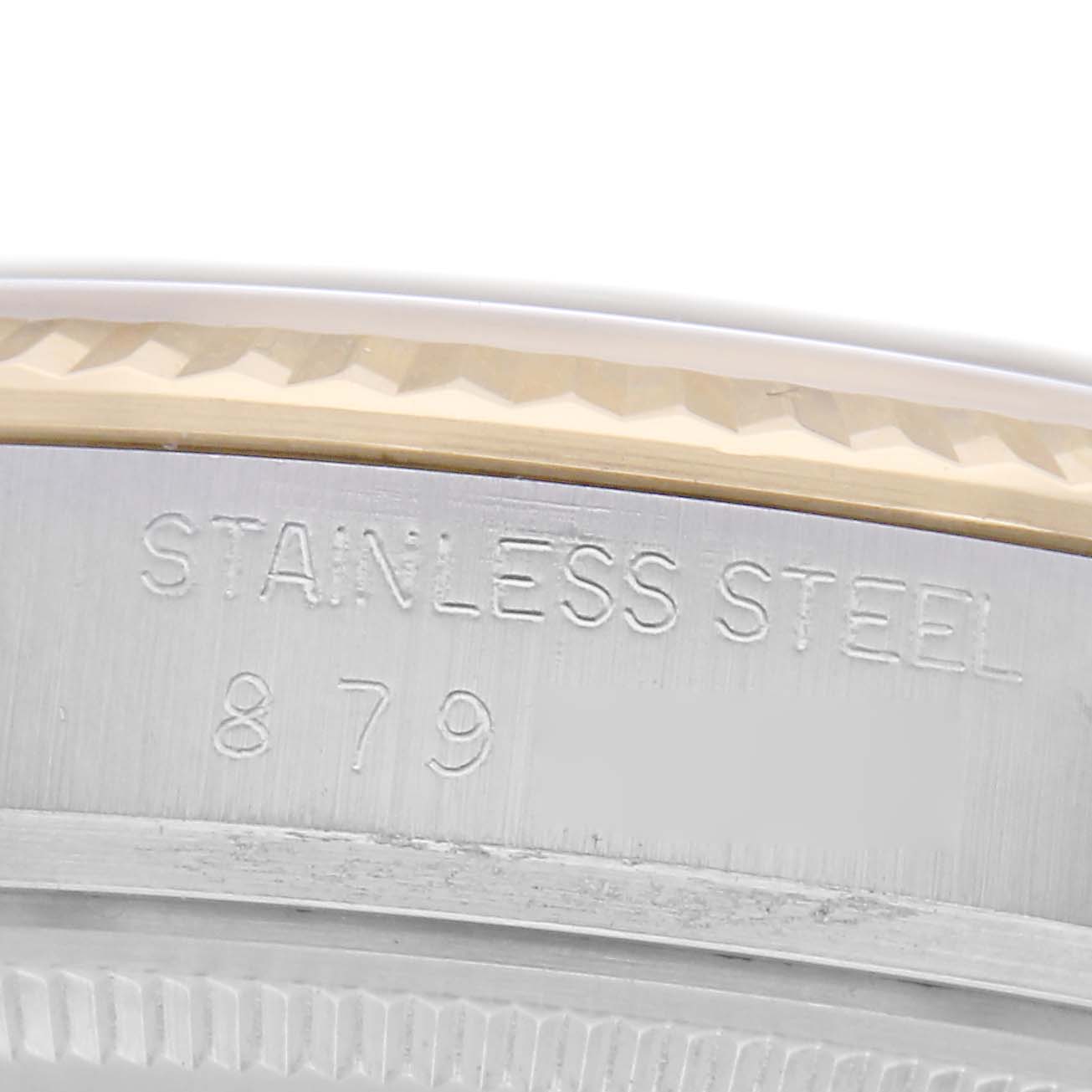 The image shows a close-up angle of the side of a Rolex Datejust 16013, focusing on the stainless steel part with engraved text.