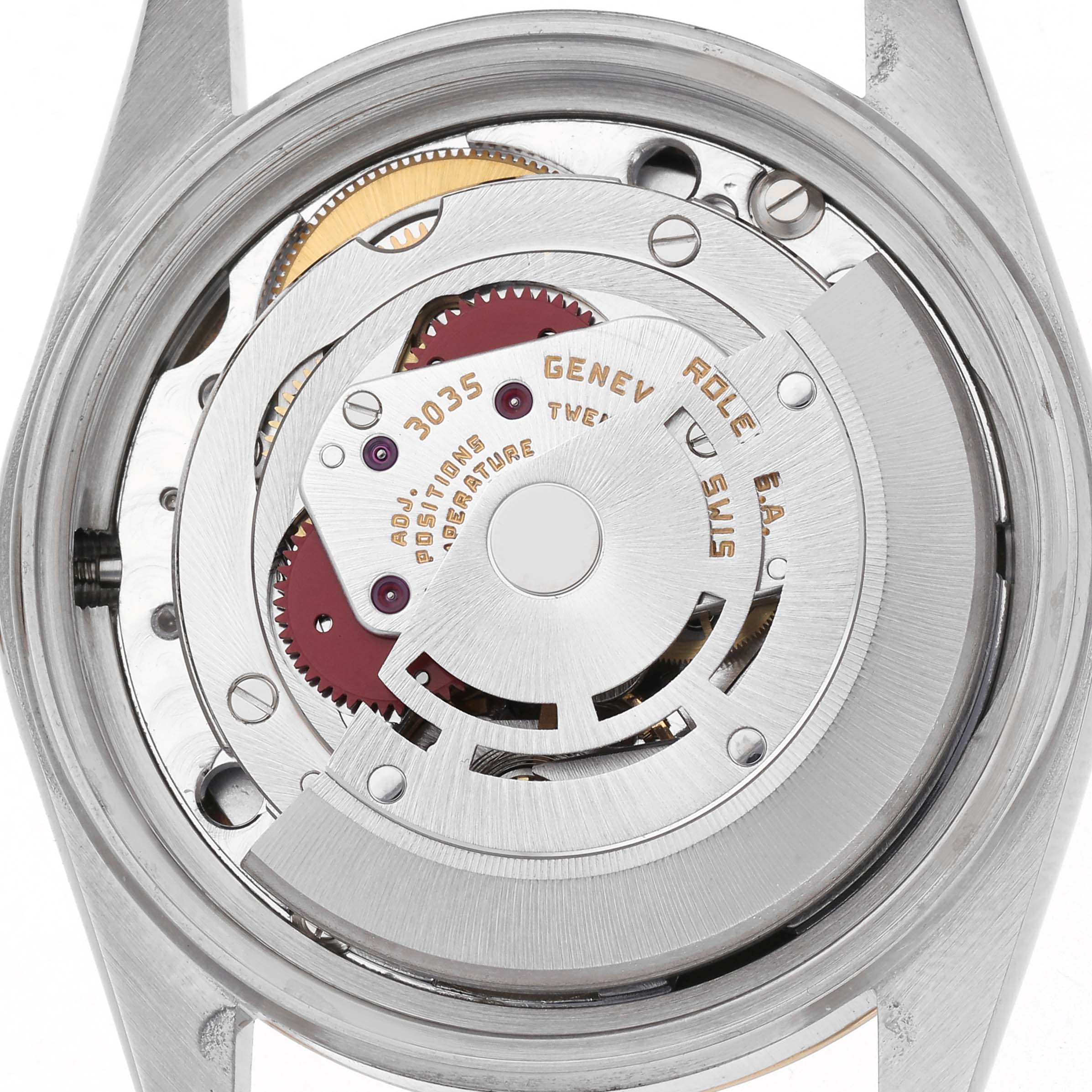 The image shows the movement mechanism of the Rolex Datejust model 16013, focusing on the intricate internal components from the back view.