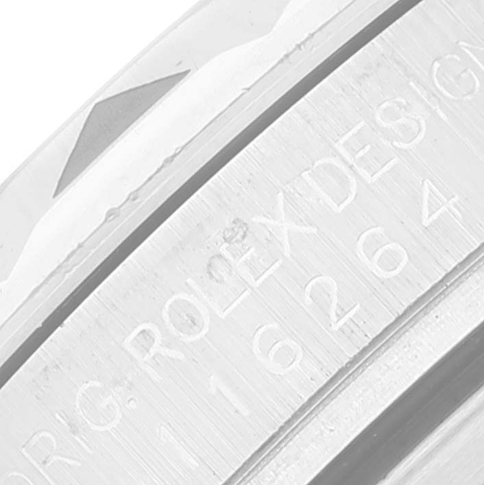 The image shows a close-up of the engraved bezel on a Rolex Turn-o-Graph 116264 Men
s Stainless Steel White Dial 116264 Men
s Stainless Steel White Dial watch.
