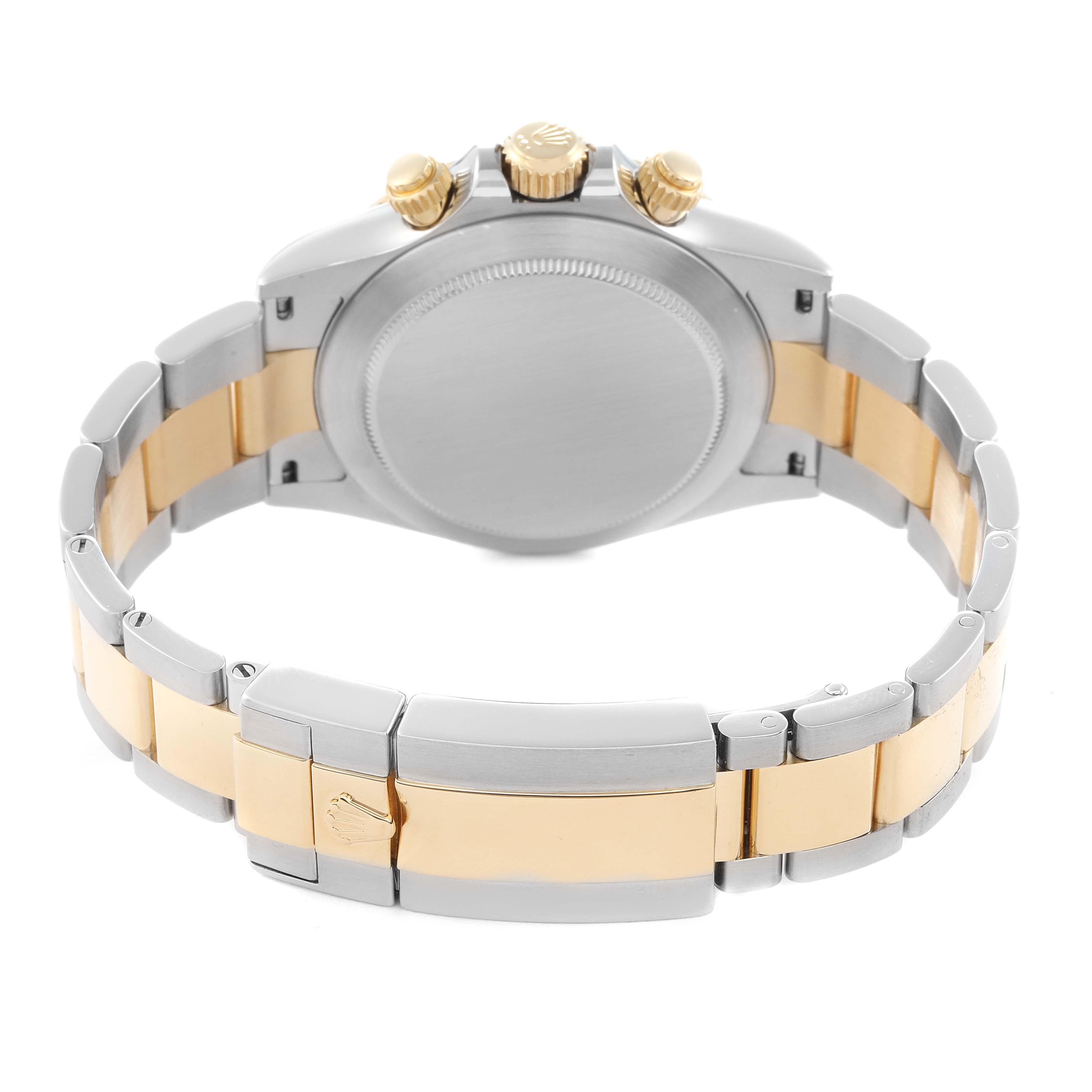 The image shows the back of a Rolex Daytona model 116523 men's watch, highlighting the bracelet, clasp, and case back from a rear angle.