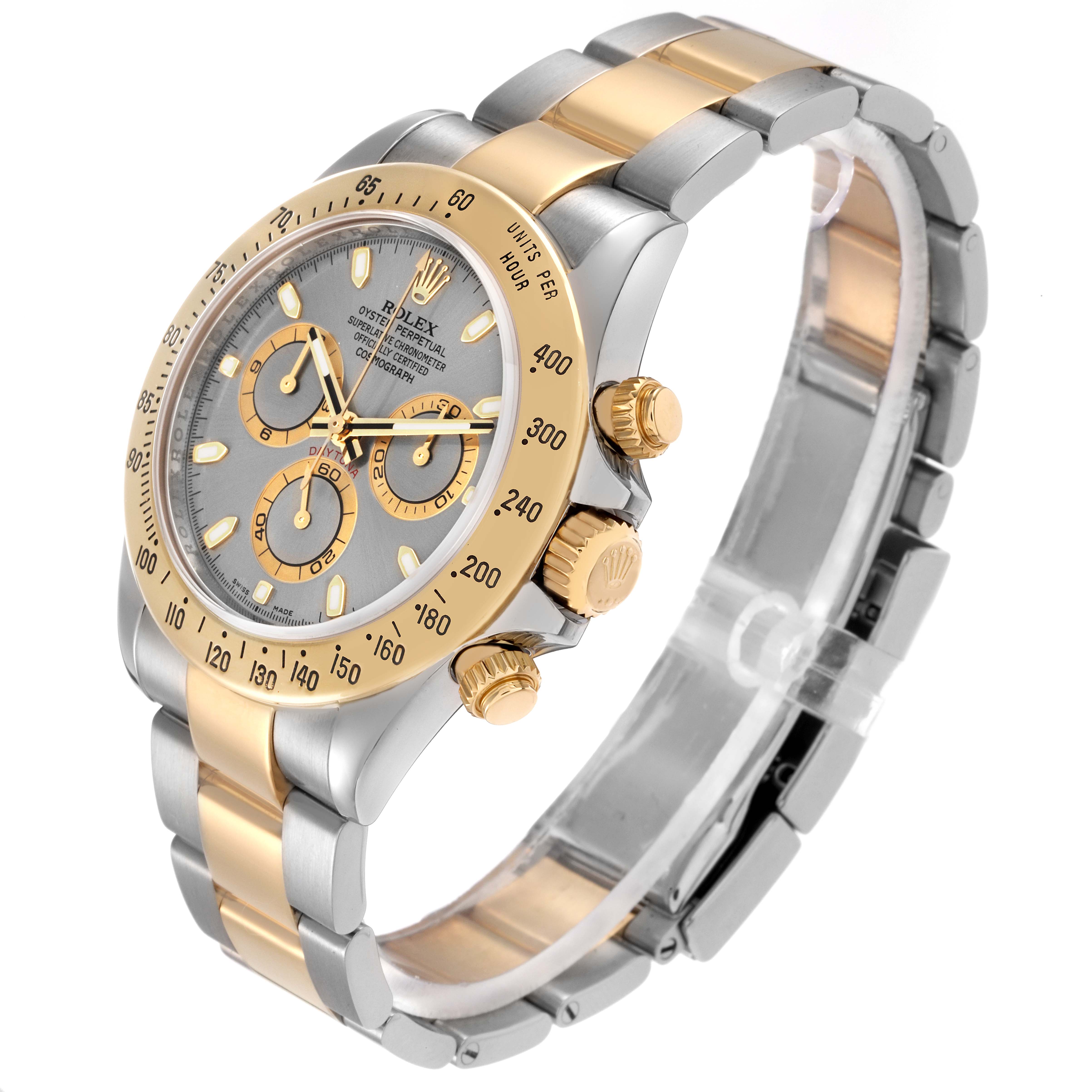 The Rolex Daytona model 116523 men's watch is shown at an angled view highlighting its dial, bezel, chronograph sub-dials, and a two-tone bracelet.
