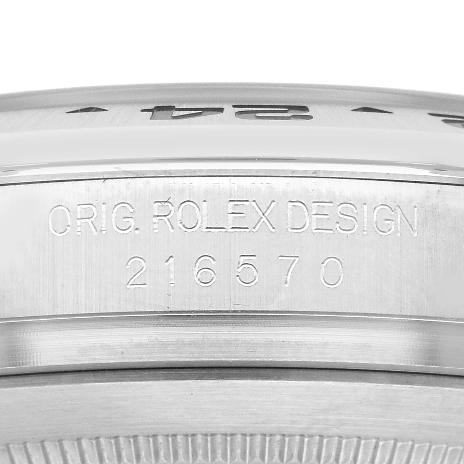 This is a close-up of the side of the Rolex Explorer 216570 Men
s Stainless Steel Black Dial 216570 Men
s Stainless Steel Black Dial watch, showing the model number 216570 and "ORIG. ROLEX DESIGN."