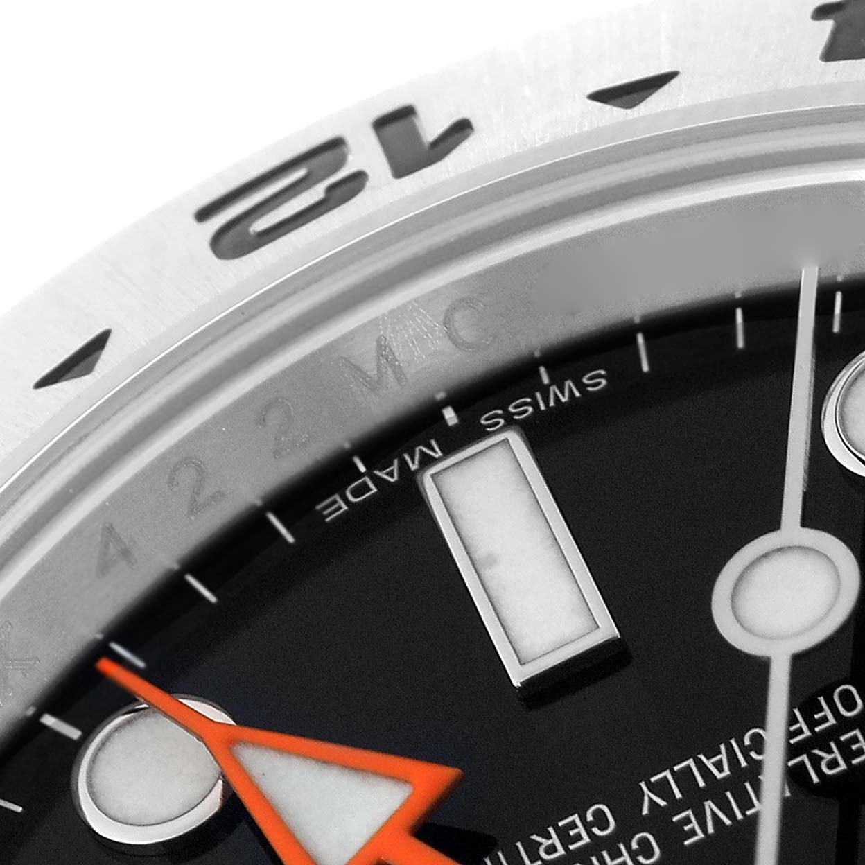 The image shows a close-up of the dial and bezel of a Rolex Explorer 216570 Men
s Stainless Steel Black Dial 216570 Men
s Stainless Steel Black Dial watch, highlighting the 24-hour marker, orange hand, and "Swiss Made" text.