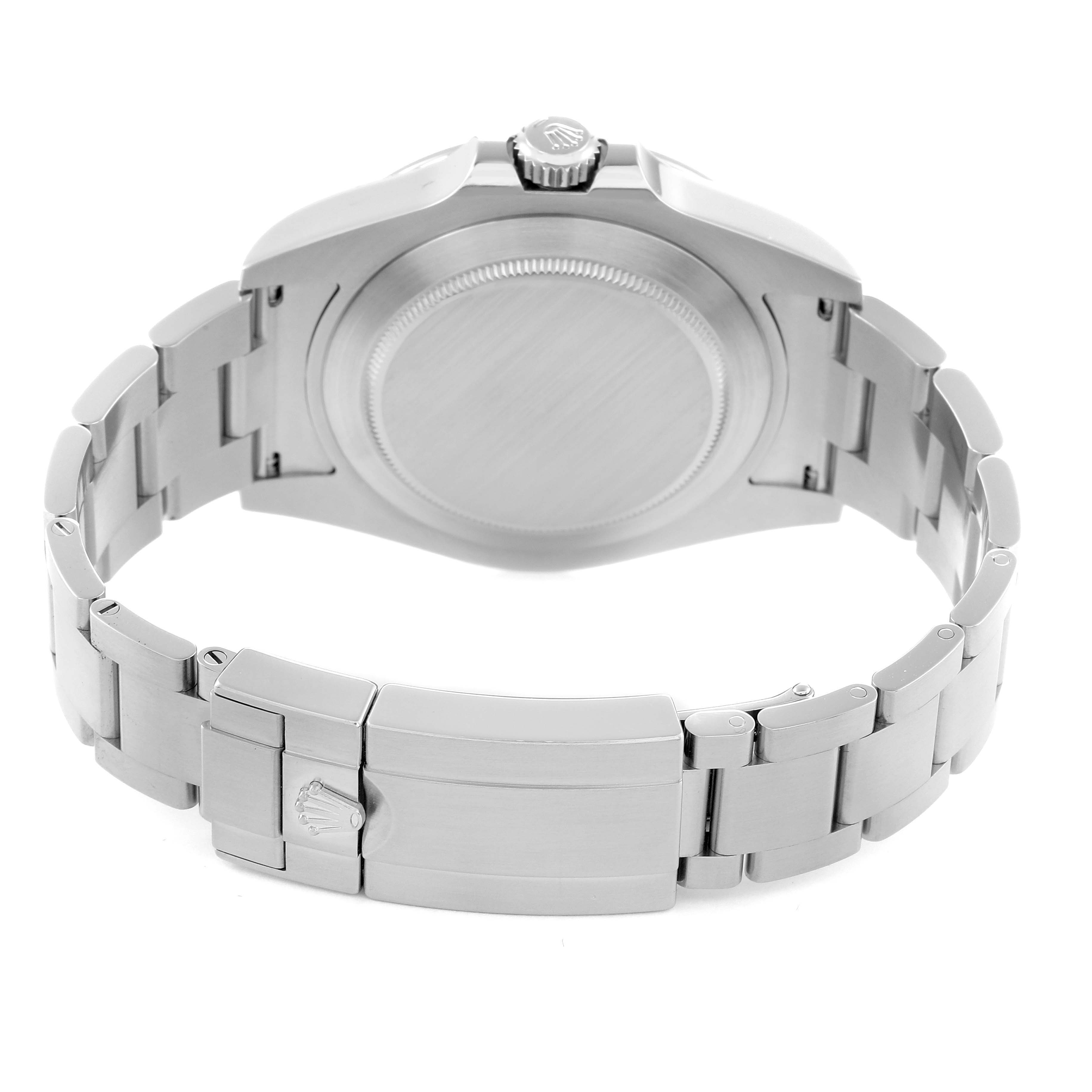 The image shows the back view of the Rolex Explorer model 216570 men's watch, highlighting the case back, crown, and bracelet with clasp.