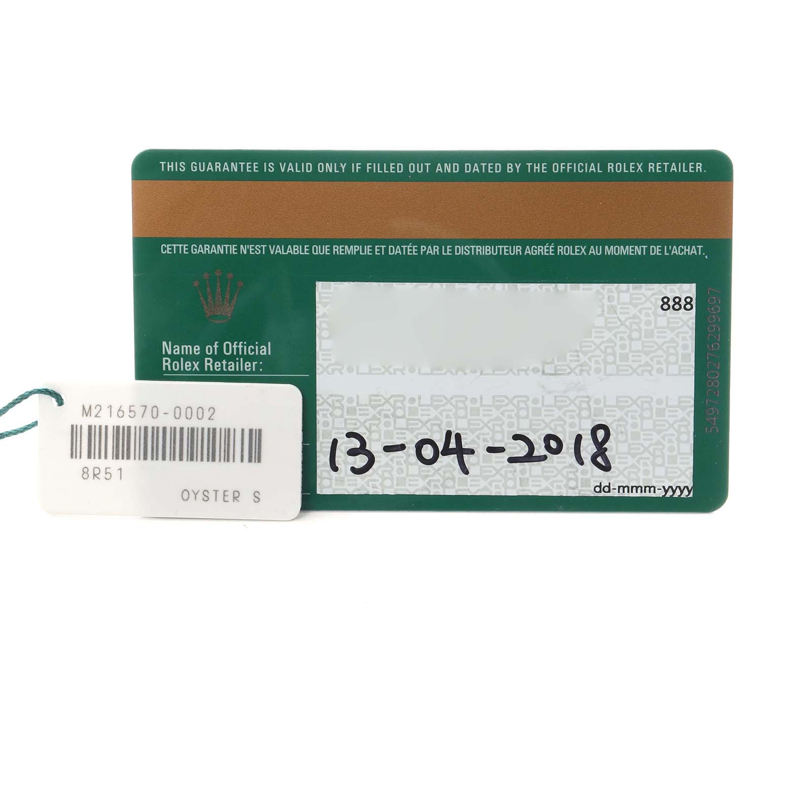The image shows a Rolex Explorer model number 216570 warranty card and tag, viewed from the front, displaying the purchase date and product details.