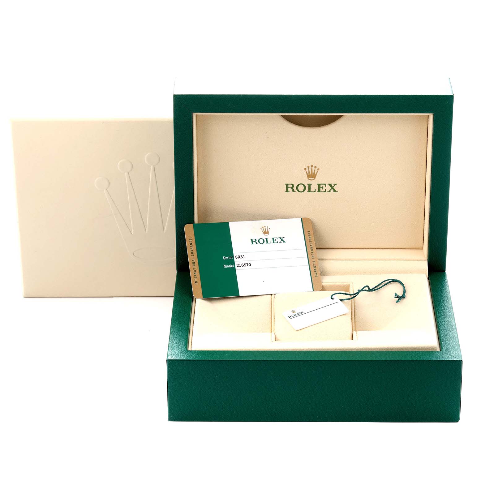 The image shows a Rolex Explorer model 216570 men's watch box, with an open lid revealing a warranty card and a tag inside.