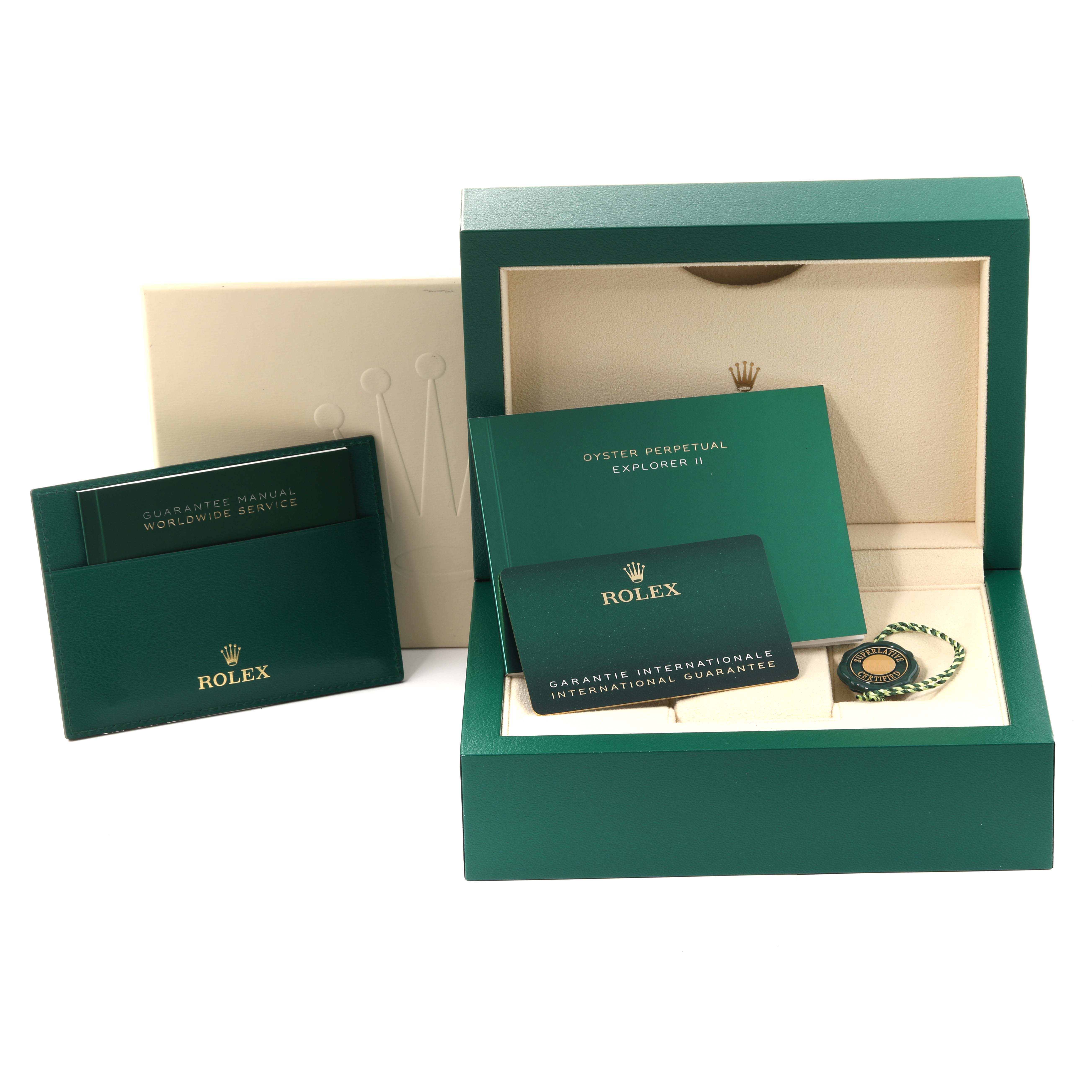 The image shows the packaging, guarantee manual, international guarantee card, and tag of the Rolex Explorer 226570 Men's Stainless Steel White Dial 226570 Men's Stainless Steel White Dial model.