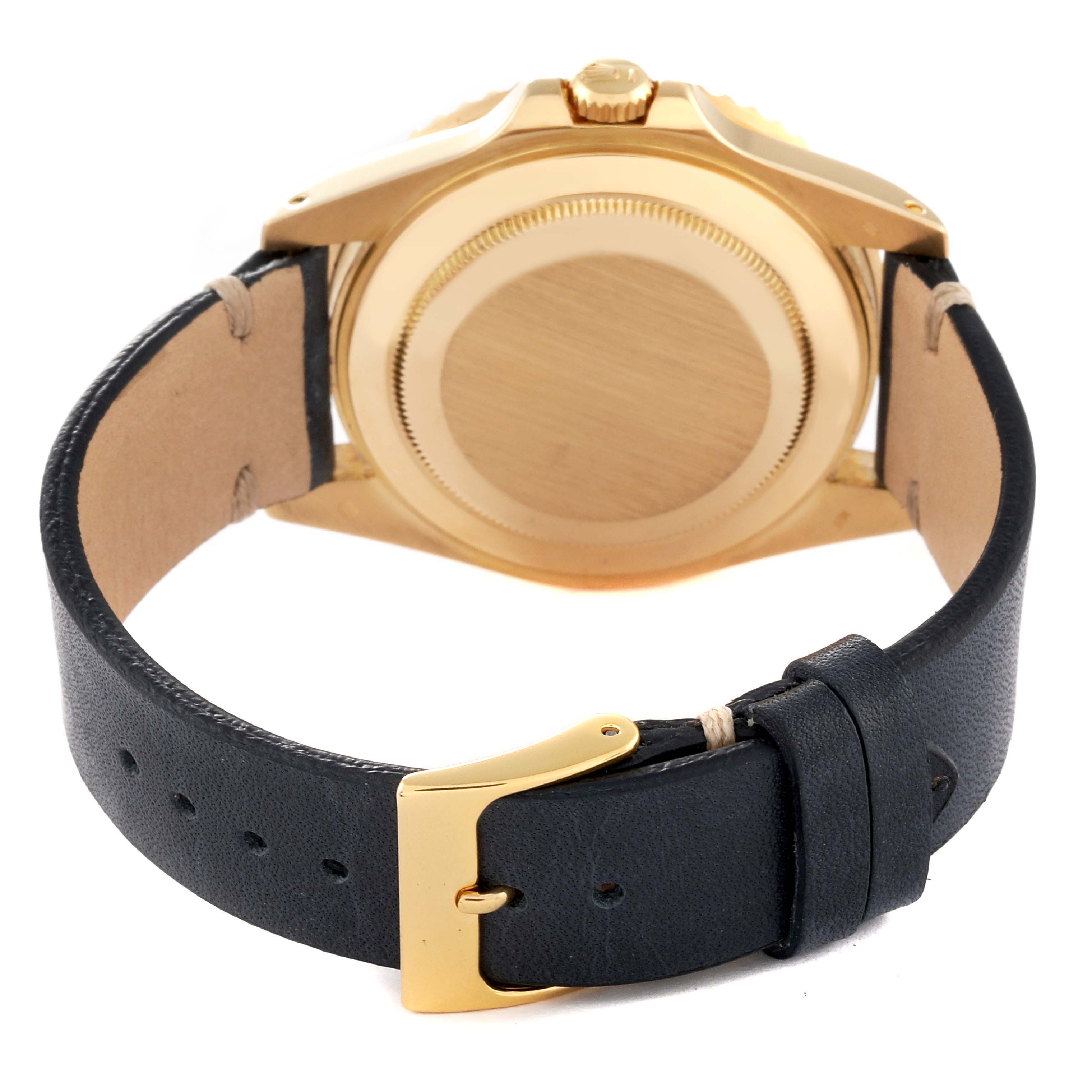 The image shows the back and clasp of a Rolex GMT-Master 16718 Men's Yellow Gold Black Dial 16718 Men's Yellow Gold Black Dial watch with a black leather strap and gold case.