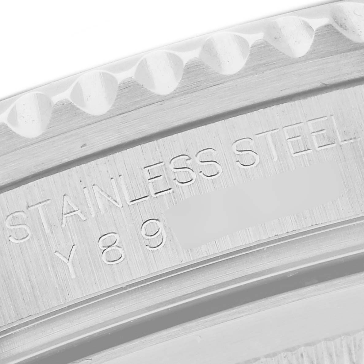 This image shows a close-up of the bezel and the engraved serial number of a Rolex GMT-Master 16710 Men
s Stainless Steel Black Dial 16710 Men
s Stainless Steel Black Dial watch.