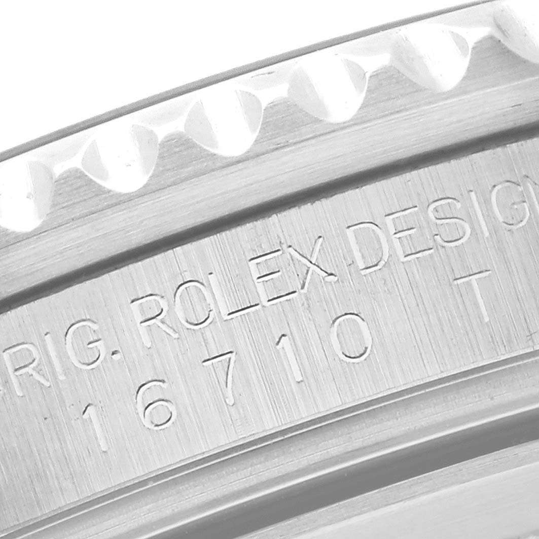 This image shows a close-up of the engraved case and bezel of the Rolex GMT-Master 16710 Men
s Stainless Steel Black Dial 16710 Men
s Stainless Steel Black Dial model.