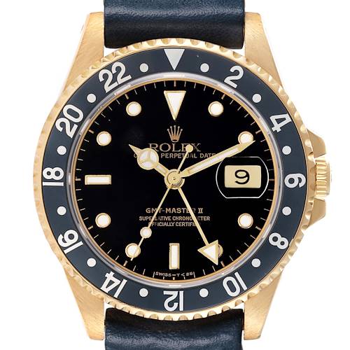 The Rolex GMT-Master 16718 Men's Yellow Gold Black Dial watch is shown from a front angle, displaying its bezel, dial, and crown.