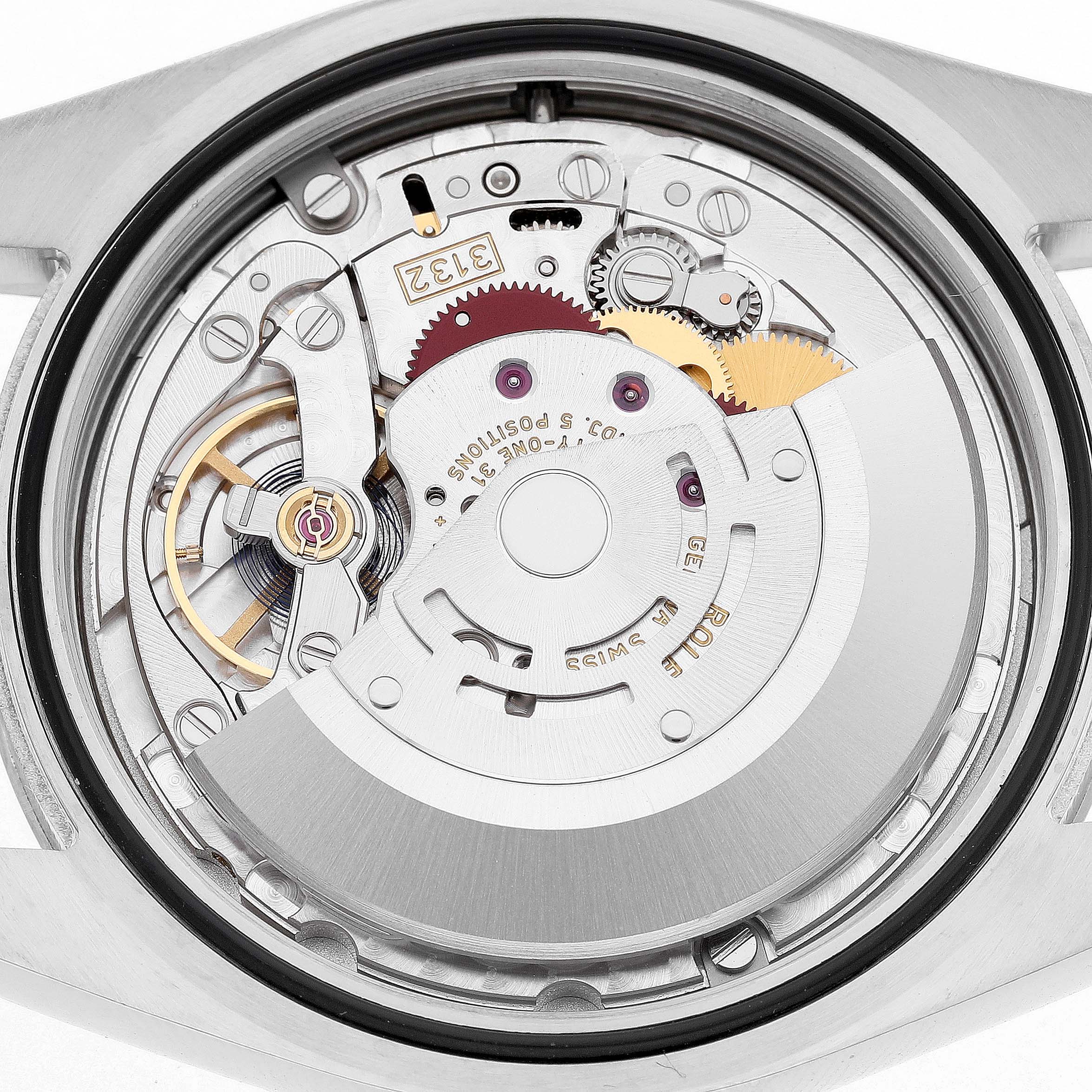 The image shows the movement of a Rolex Oyster Perpetual 114300 Men's Stainless Steel Grey Dial watch from the back, highlighting its intricate gears and components.