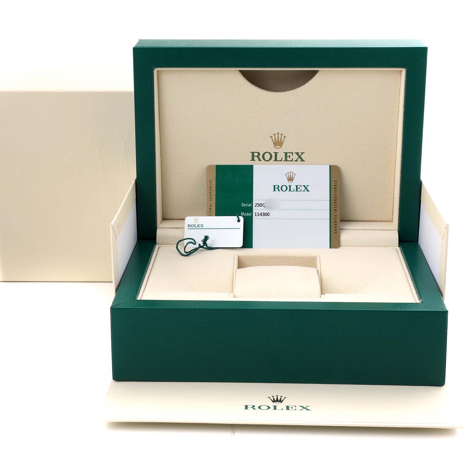 The image shows an open Rolex Oyster Perpetual 114300 Men's Stainless Steel Grey Dial box with a warranty card and tag, viewed from the front.