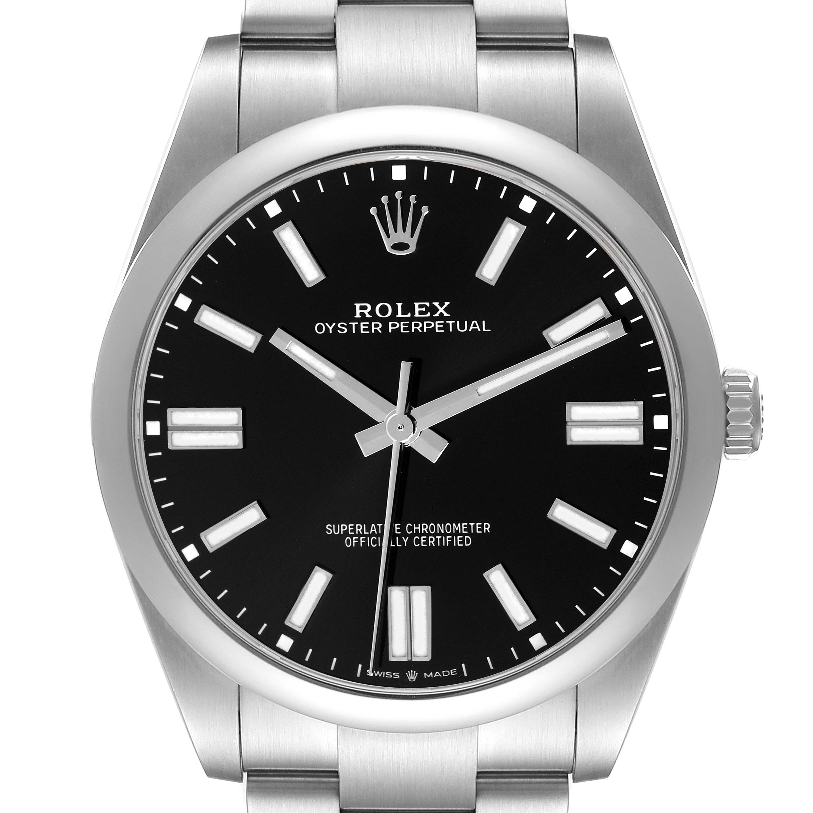 The image shows a front view of the Rolex Oyster Perpetual model 124300 men's watch, featuring its black dial, hour markers, hands, and part of the bracelet.