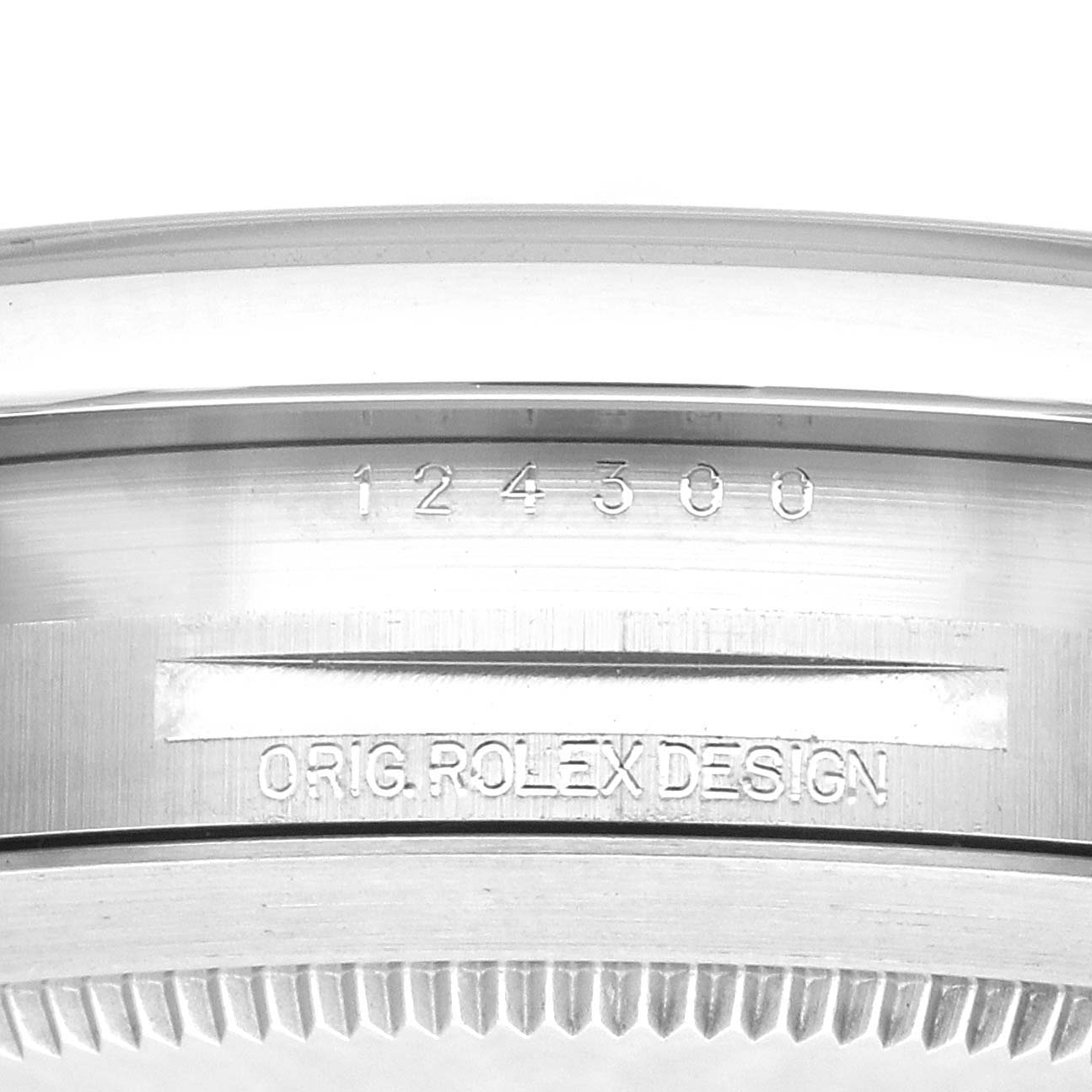 The image shows the side profile of a Rolex Oyster Perpetual model 124300, focusing on the case edge with visible engravings of the model number and "ORIG. ROLEX DESIGN."