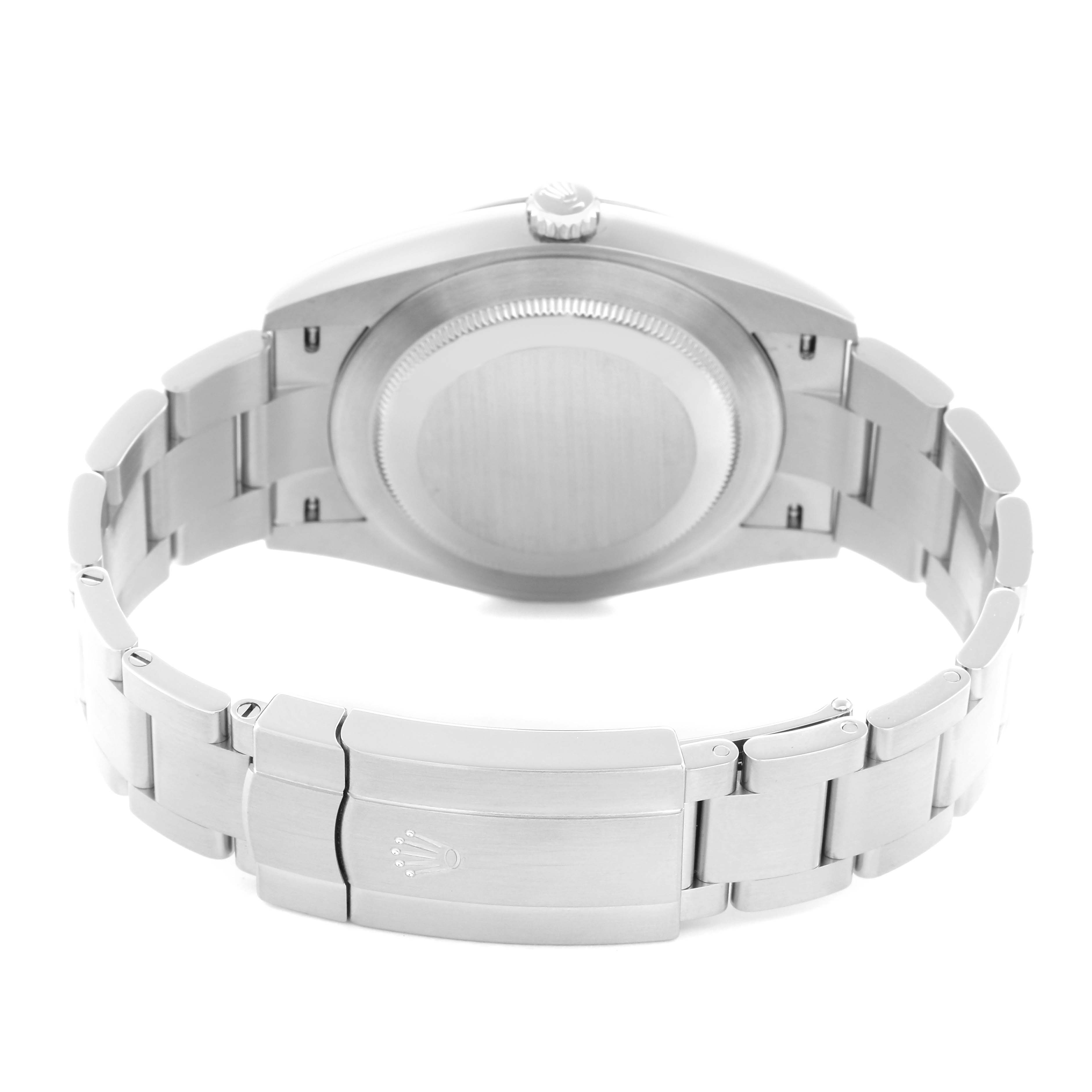 The image shows the back view of a Rolex Oyster Perpetual model 124300 men's watch, highlighting the case back and bracelet clasp.