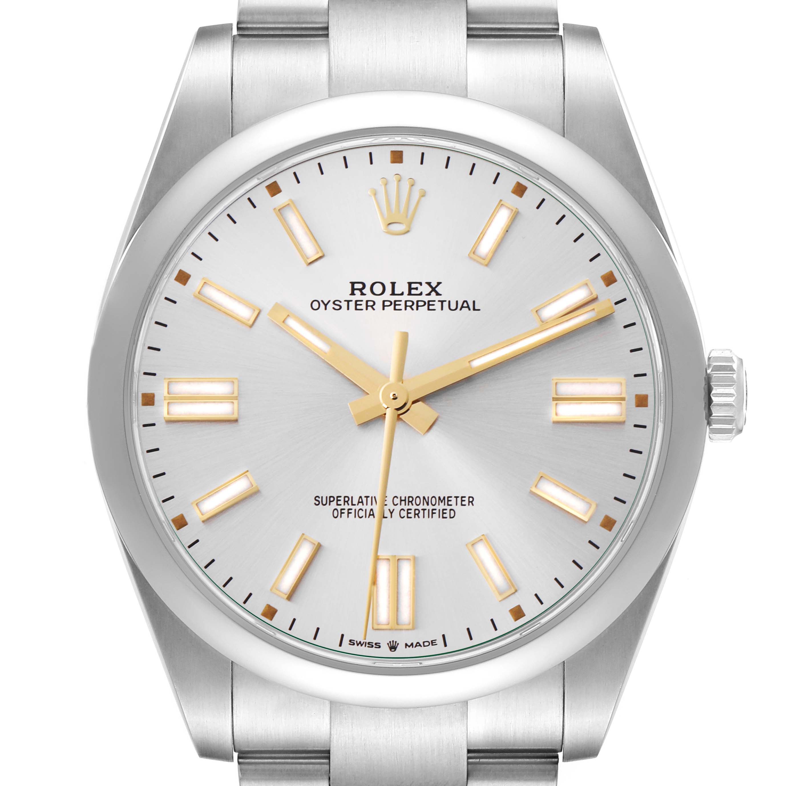 The Rolex Oyster Perpetual model 124300 is shown from the front, highlighting the dial, hands, indices, and part of the bracelet.