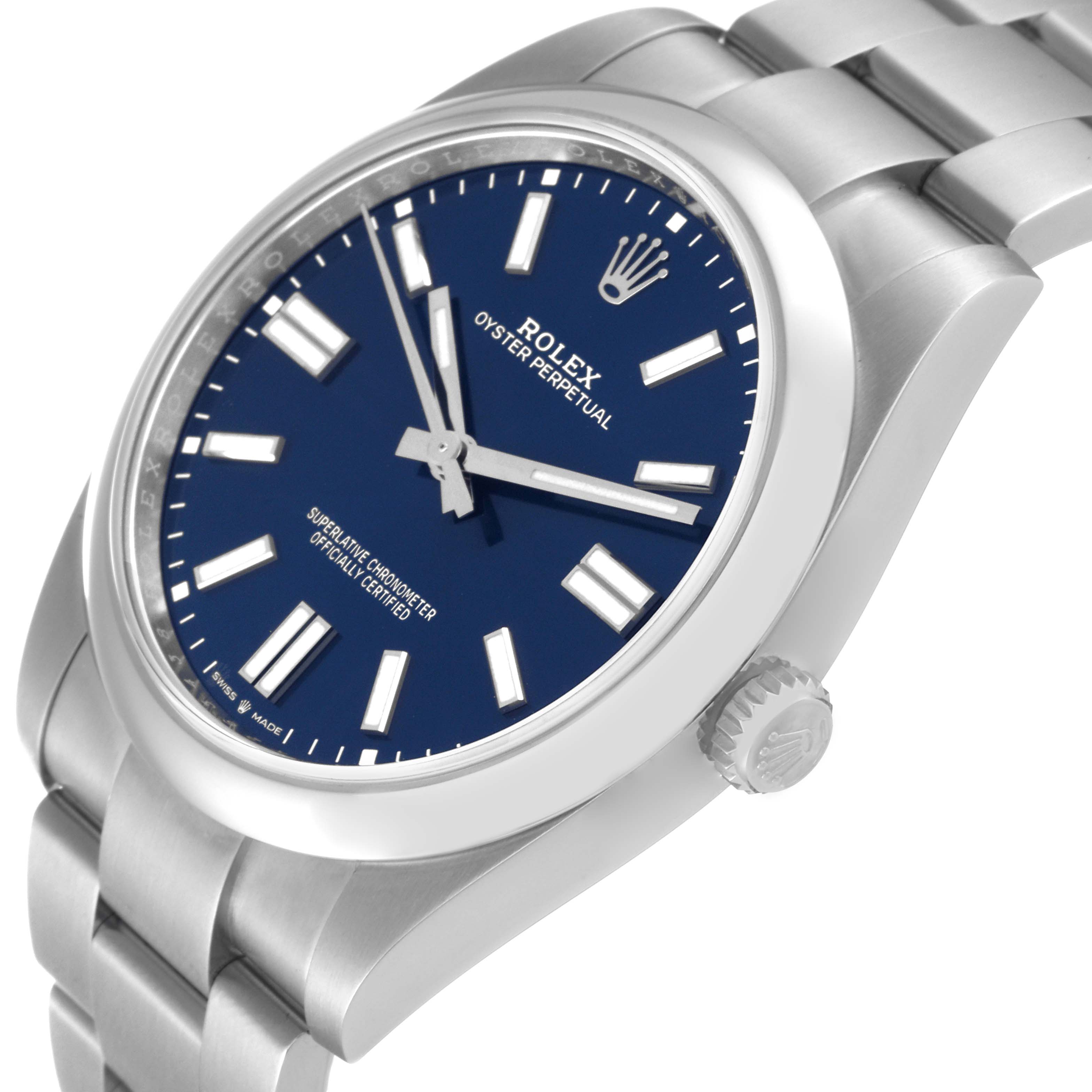 The angled view of the Rolex Oyster Perpetual 124300 Men's Stainless Steel Blue Dial 124300 Men's Stainless Steel Blue Dial watch shows its dial, crown, and part of the bracelet.