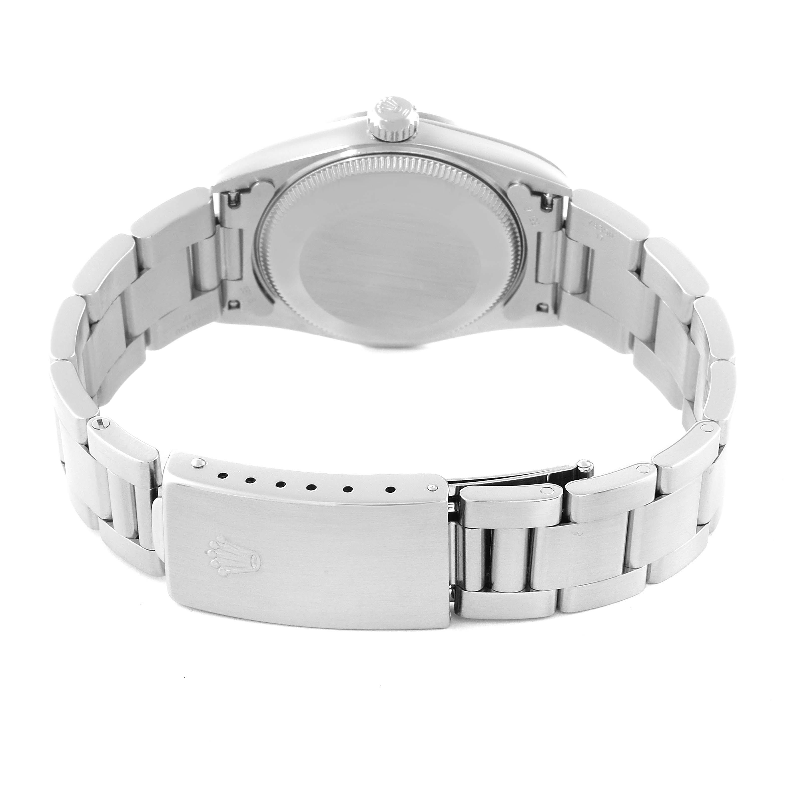 The image shows the back view of a Rolex Oyster Perpetual watch, highlighting the bracelet, clasp, and case back.