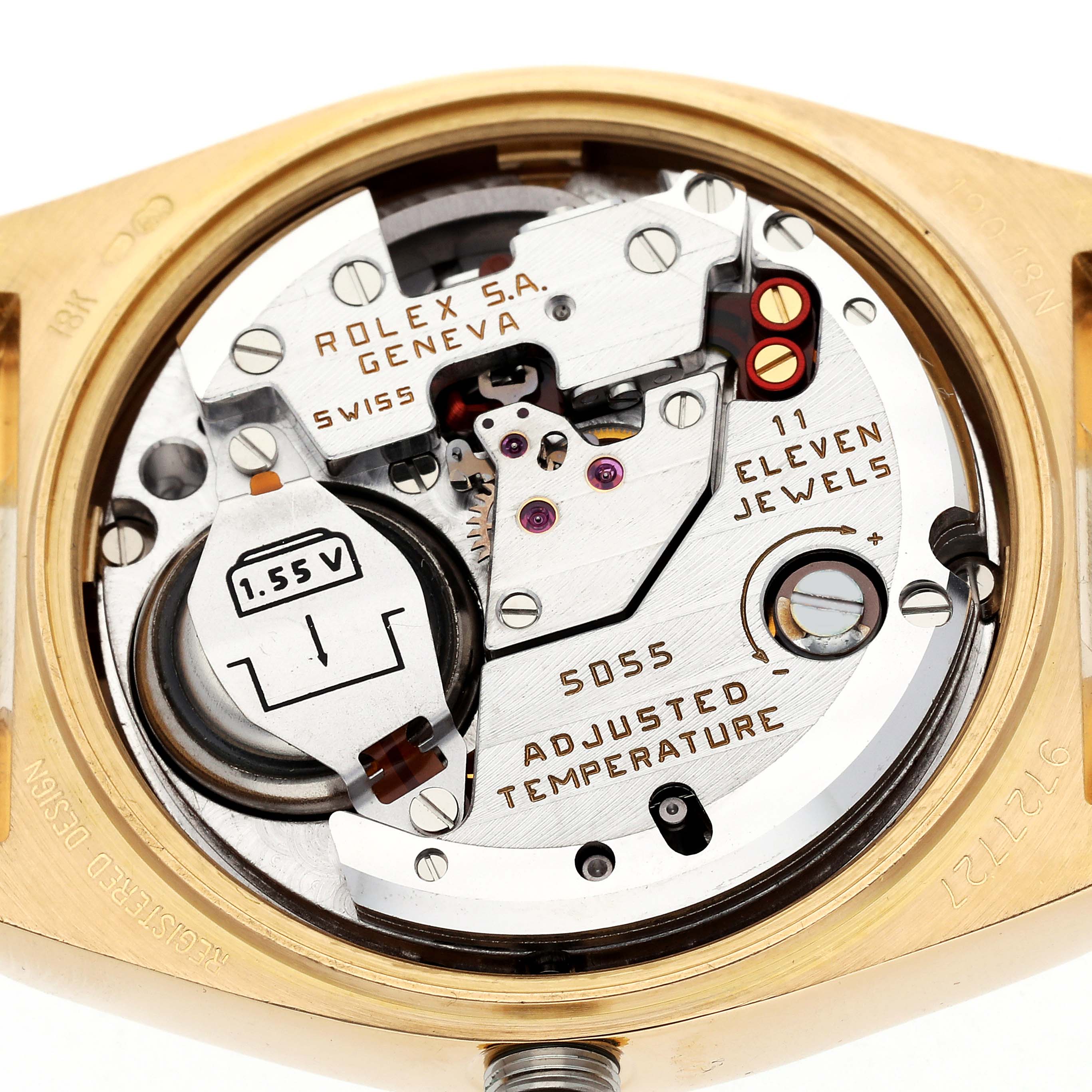 The image shows the movement and internal mechanism of a Rolex Oysterquartz model 19018N men's watch, viewed from the back with intricate details visible.