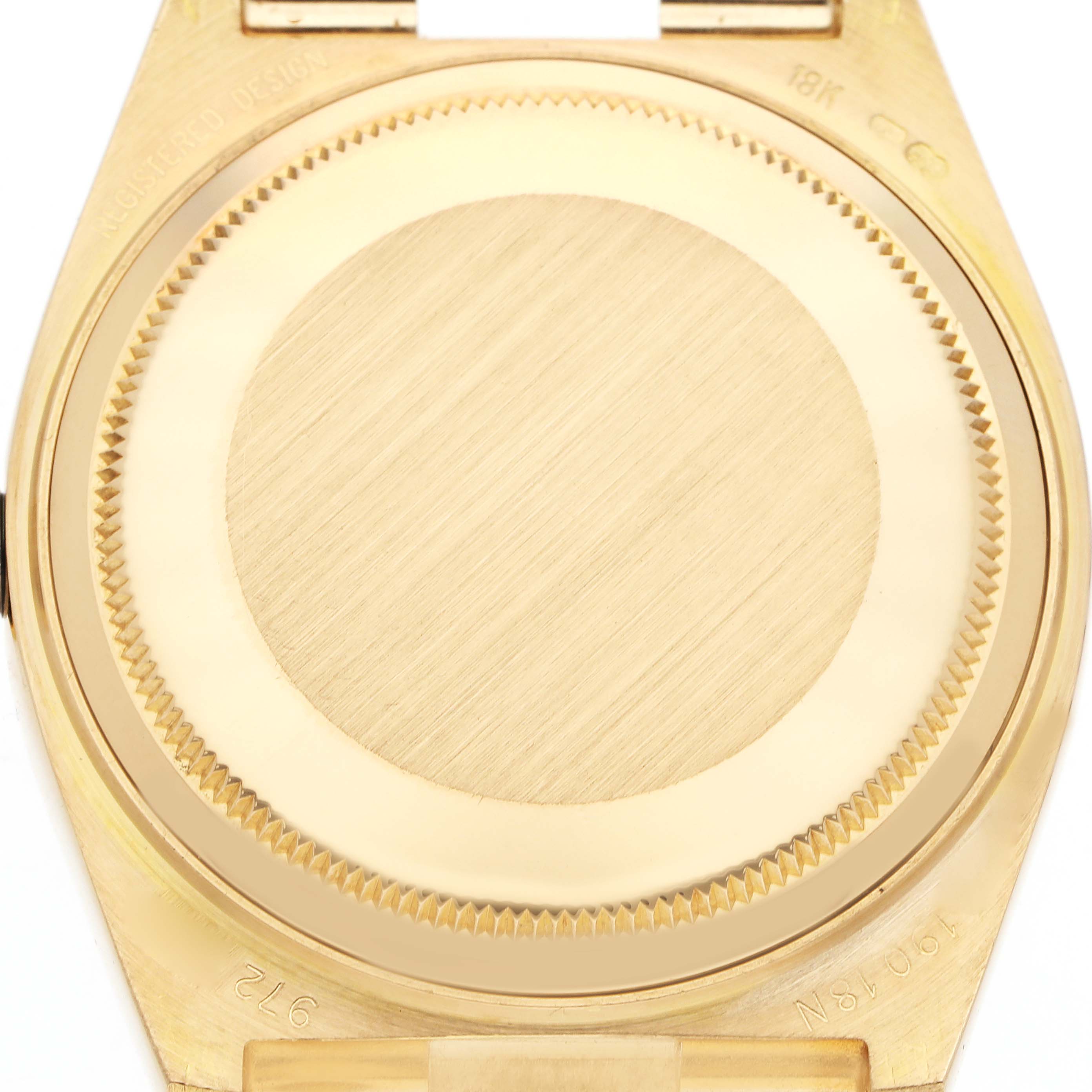 The image shows the case back of a Rolex Oysterquartz model 19018N, highlighting the brushed finish and engravings.