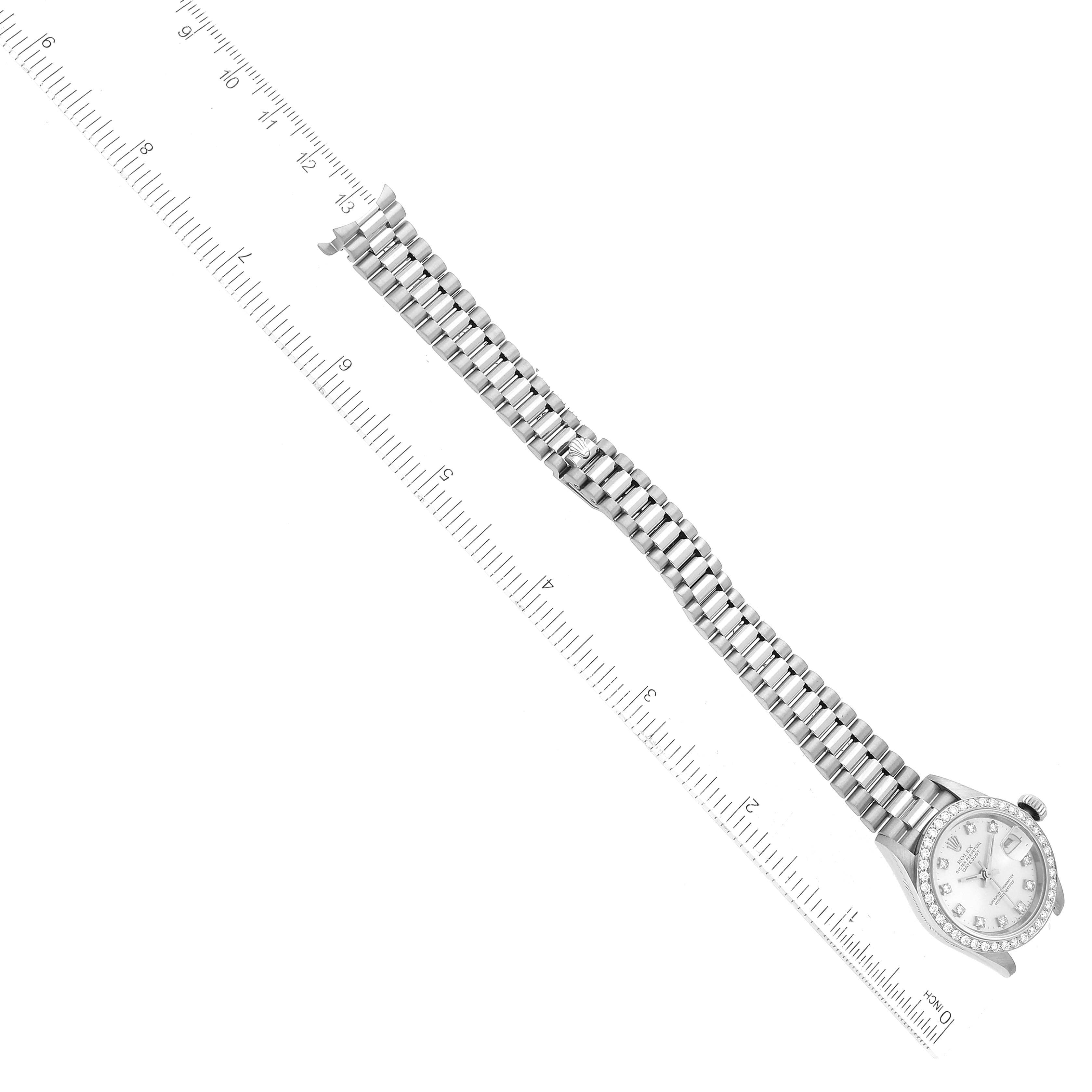 The image shows a full view of a Rolex President 69139 Women's White Gold Silver Dial 69139 Women's White Gold Silver Dial watch with a ruler alongside it.