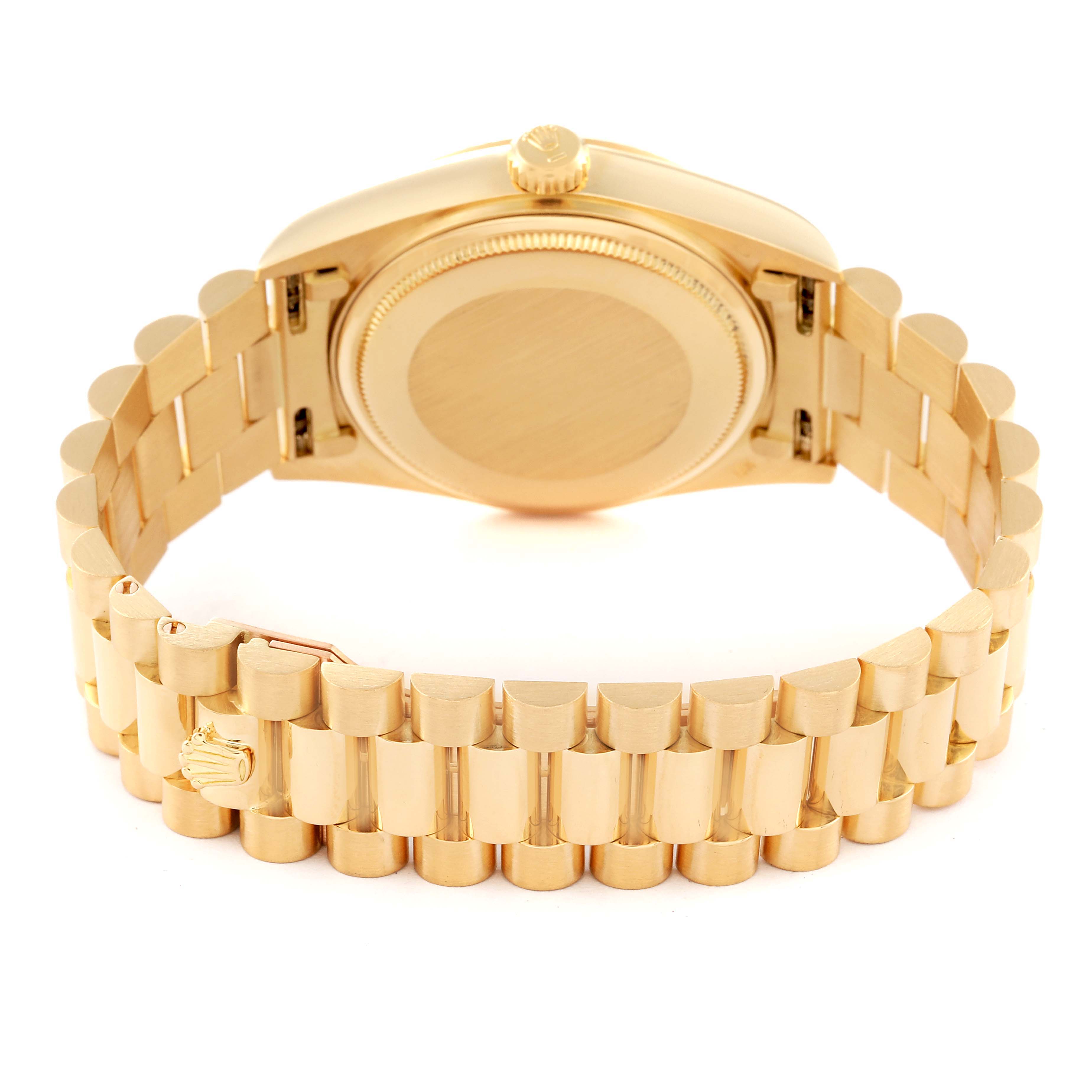 The image shows the back view of a gold Rolex President 18038 Men
s Yellow Gold Champagne Dial 18038 Men
s Yellow Gold Champagne Dial model watch, highlighting its bracelet and caseback.