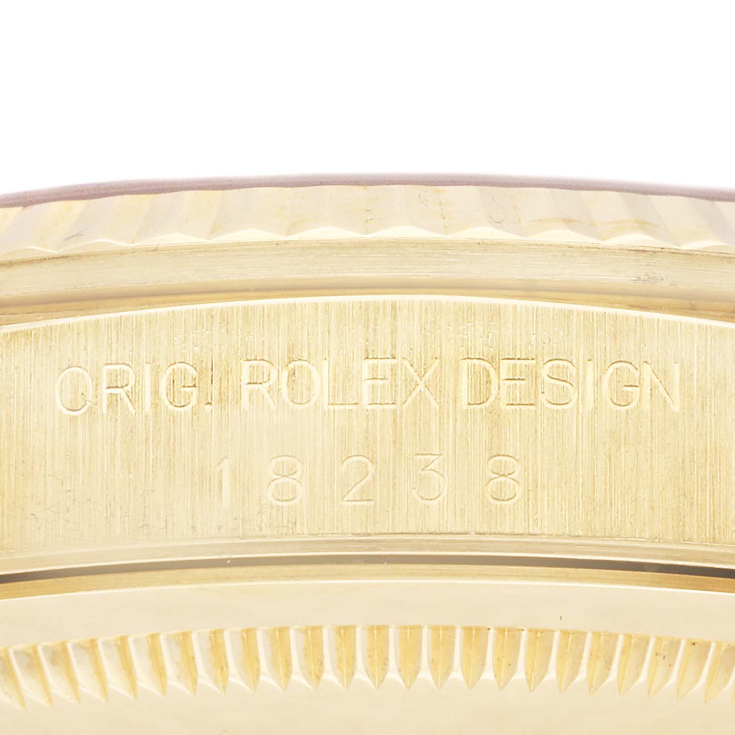 This image shows a close-up of the engraved caseback rim of a Rolex President 18238 Men
s Yellow Gold Champagne Dial 18238 Men
s Yellow Gold Champagne Dial model watch, featuring the model number 18238.