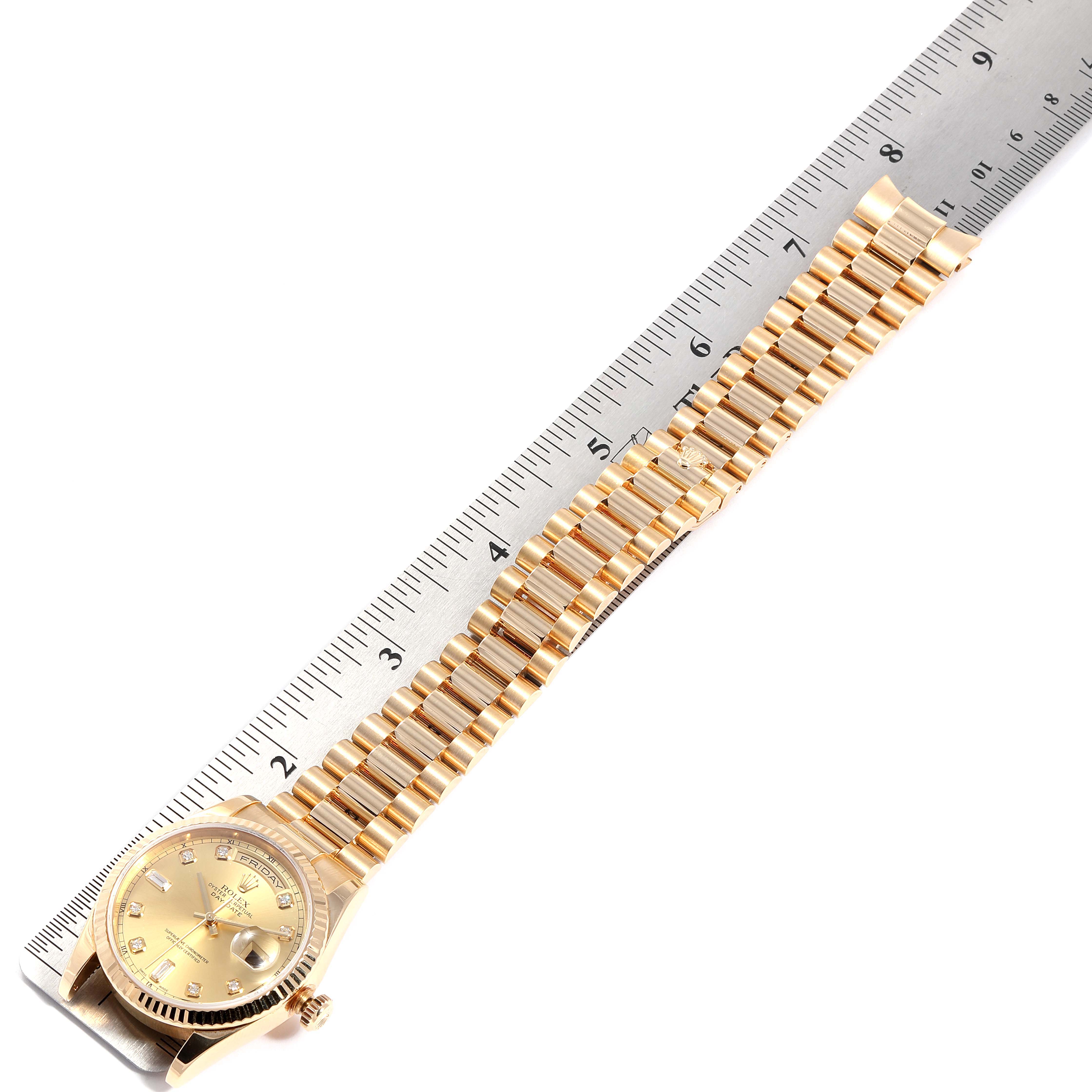 The image shows a top-down view of a Rolex President 118238 Men's Yellow Gold Champagne Dial 118238 Men's Yellow Gold Champagne Dial model watch, highlighting the face and bracelet, aligned with a ruler.