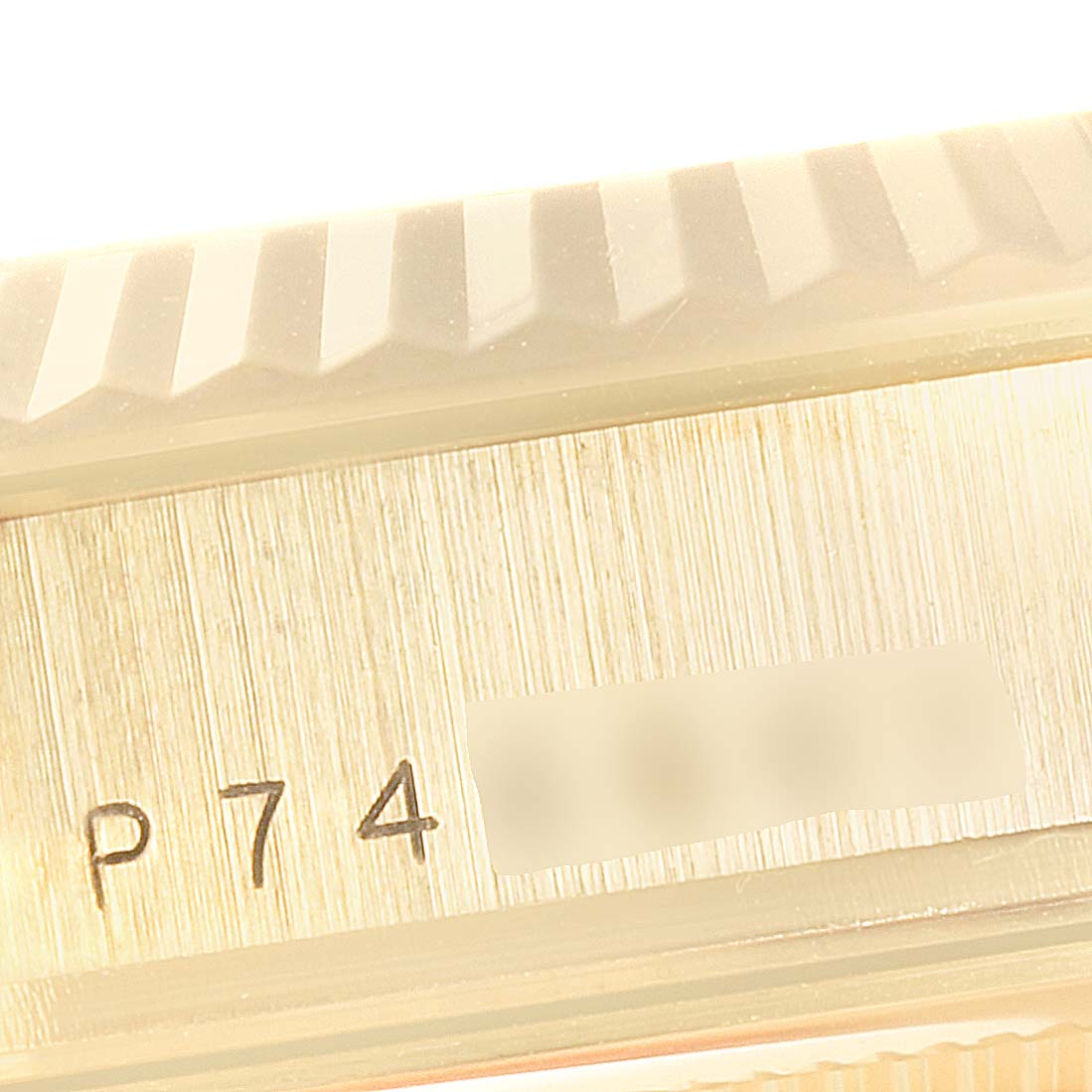 This image shows a close-up of the serial number area and bezel of a Rolex President 118238 Men's Yellow Gold Champagne Dial 118238 Men's Yellow Gold Champagne Dial model watch.