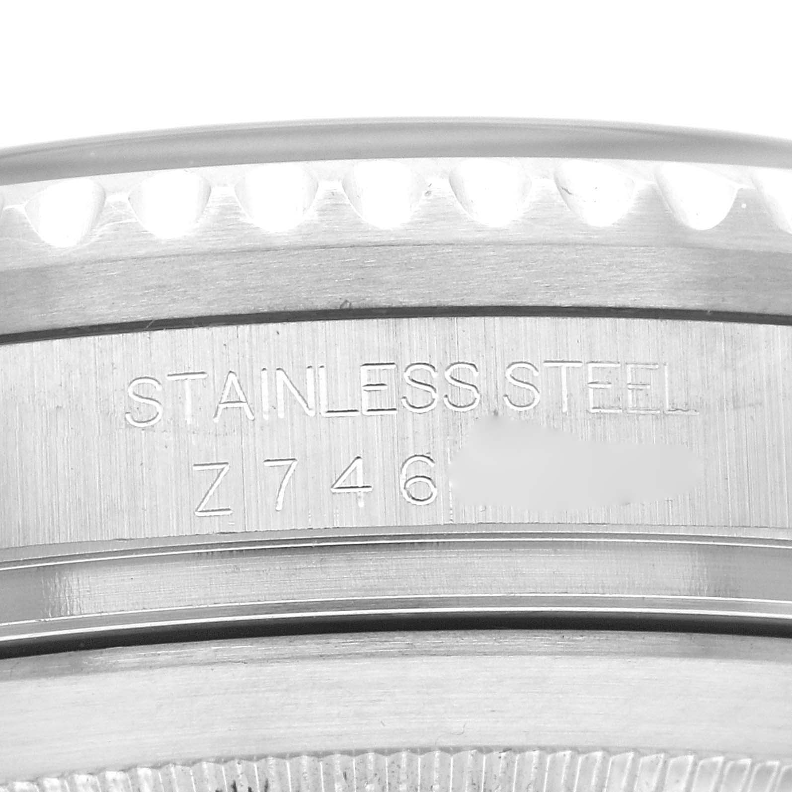 The image shows a close-up of the side and case back of the Rolex Sea-Dweller 16600 Men's Stainless Steel Black Dial 16600 Men's Stainless Steel Black Dial watch, highlighting the engraved serial number and "STAINLESS STEEL" text.