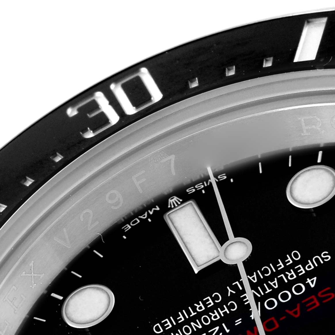 This image shows a close-up of the dial, bezel, and part of the second hand of the Rolex Sea-Dweller 126600 Men
s Stainless Steel Black Dial 126600 Men
s Stainless Steel Black Dial watch.