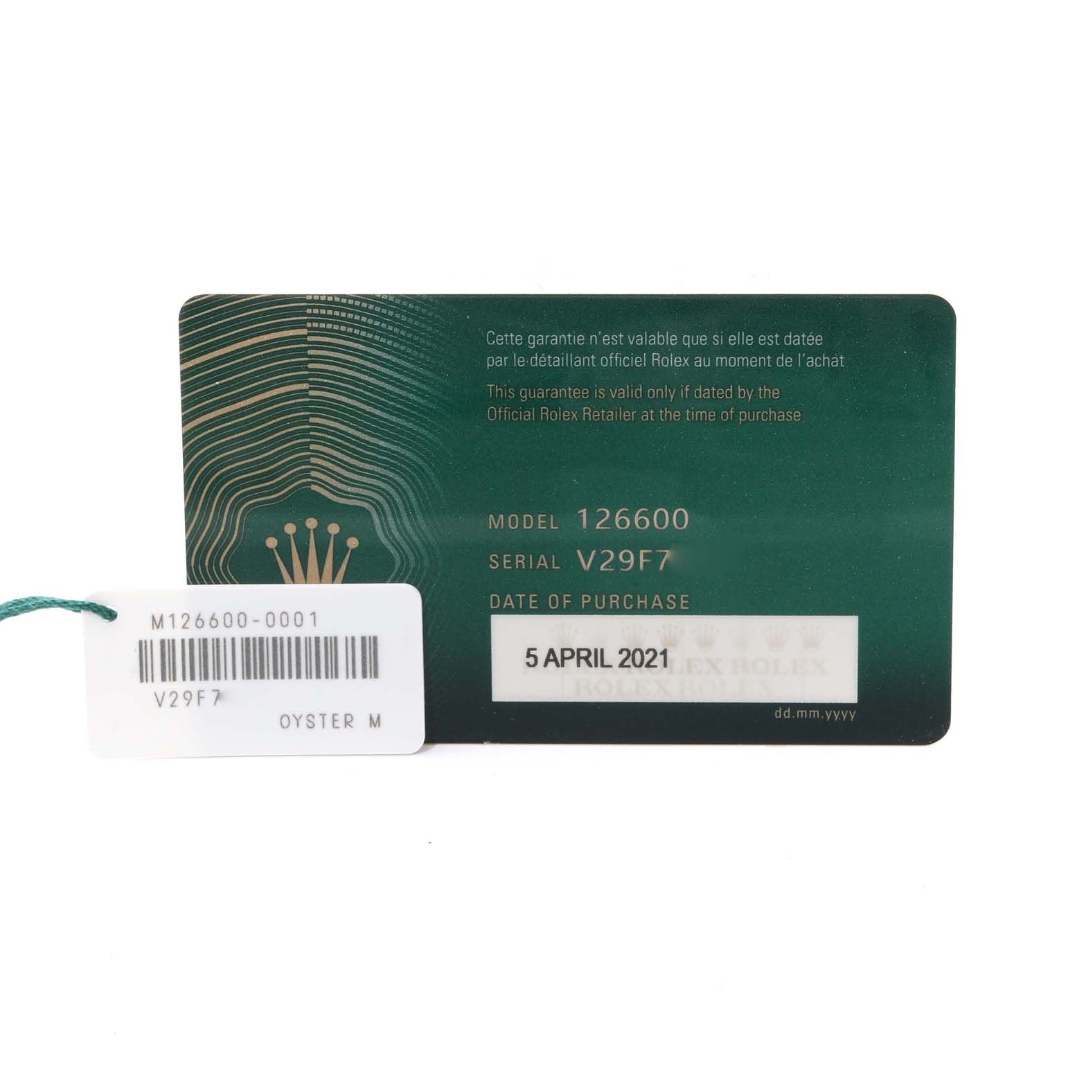 The image shows the warranty card and tag of a Rolex Sea-Dweller 126600 Men
s Stainless Steel Black Dial 126600 Men
s Stainless Steel Black Dial model 126600.