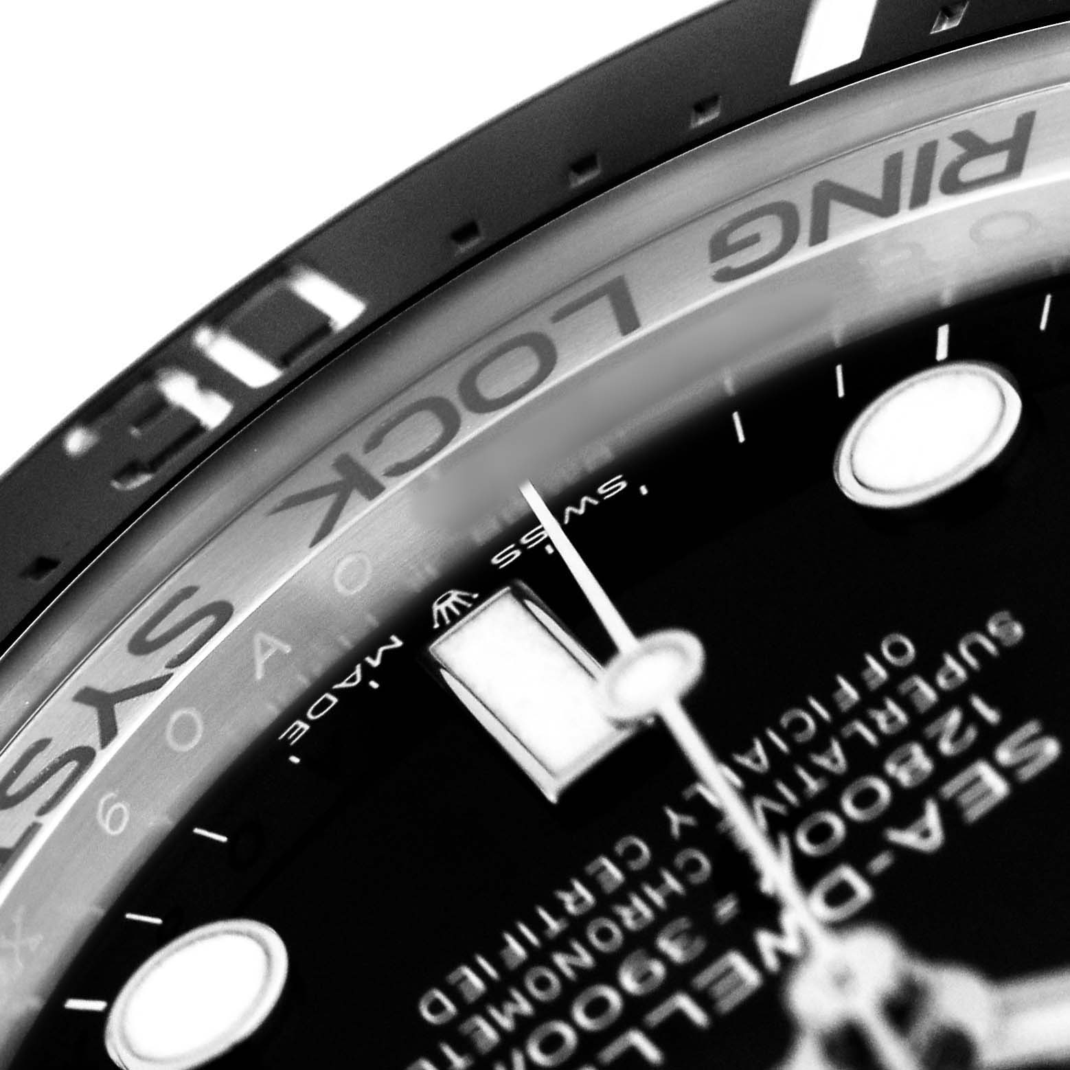 The image shows a close-up of the Rolex Sea-Dweller 126660 Men's Stainless Steel Black Dial's dial and part of the bezel.