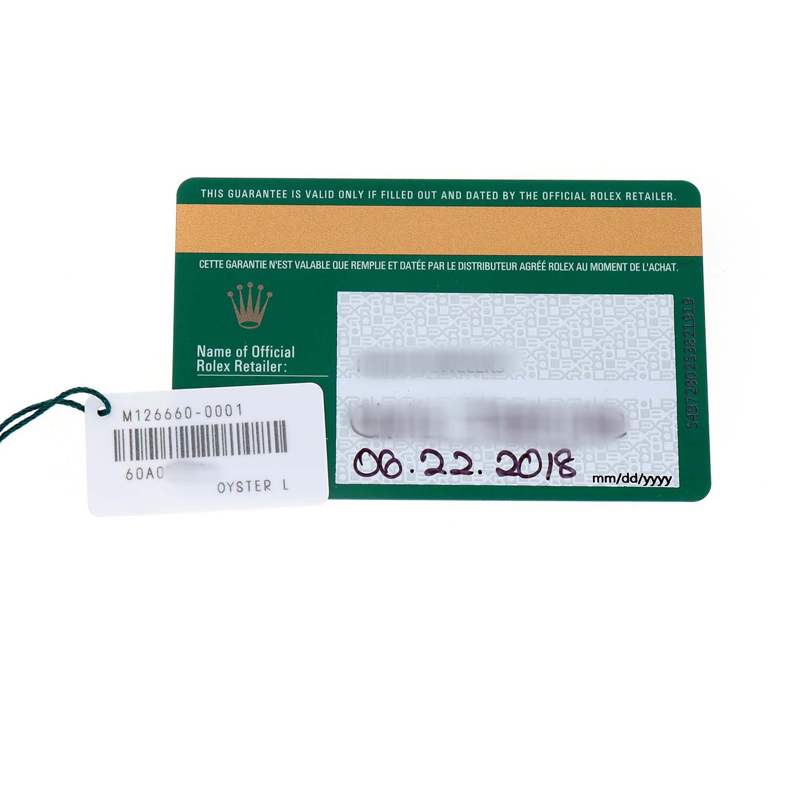 The image shows a guarantee card and tag for a Rolex Sea-Dweller 126660 Men's Stainless Steel Black Dial watch from an overhead angle.