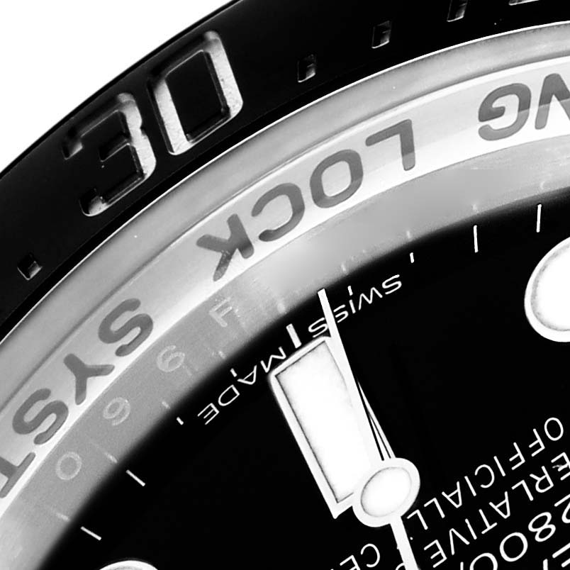 The image shows a close-up of the bezel and dial of a Rolex Sea-Dweller model 116660, highlighting the "RING LOCK SYSTEM" and minute markers.