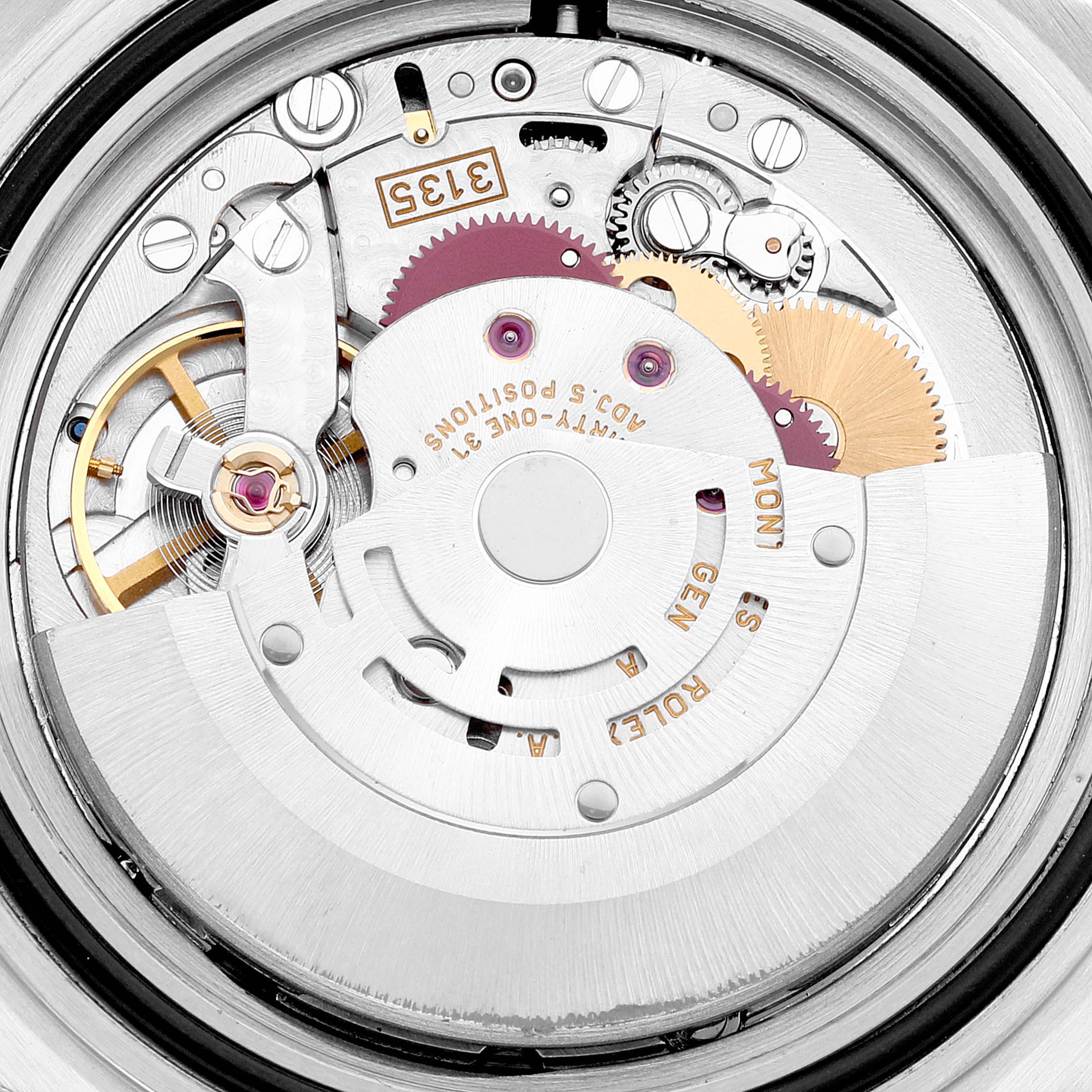 This image shows close-up details of the internal mechanism of a Rolex Submariner 16610 Men
s Stainless Steel Black Dial 16610 Men
s Stainless Steel Black Dial watch, highlighting the complex gears and components.