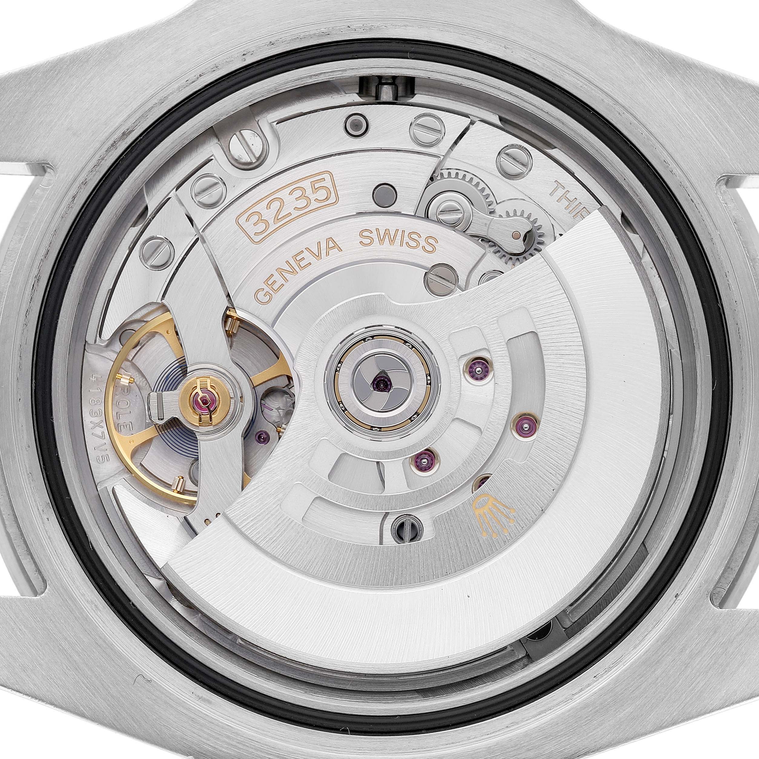 The image shows the movement of a Rolex Submariner 126610LN Men's Stainless Steel Black Dial, specifically the rotor and internal mechanical components.