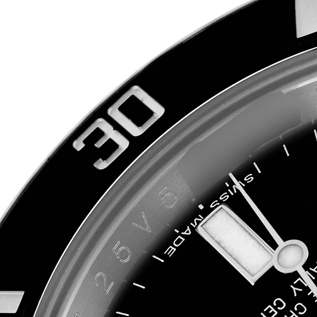 The image shows a close-up of the Rolex Submariner model 116610, highlighting part of the bezel with the "30" marking and the "Swiss Made" text on the dial.