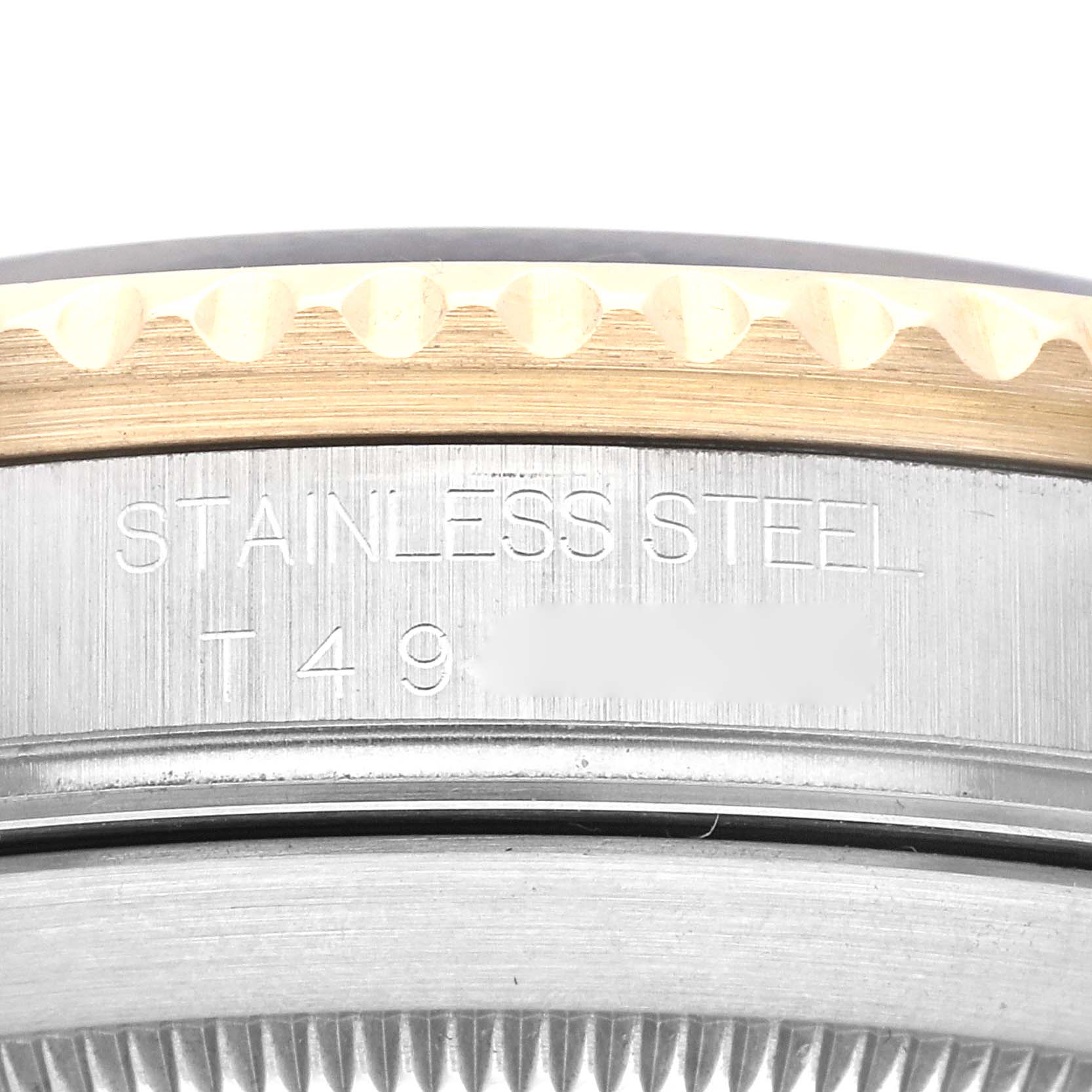 This image shows a close-up of the side view of the Rolex Submariner 16613 Men's Steel and Gold (two tone) Black Dial 16613 Men's Steel and Gold (two tone) Black Dial watch, highlighting the stainless steel and inscription.