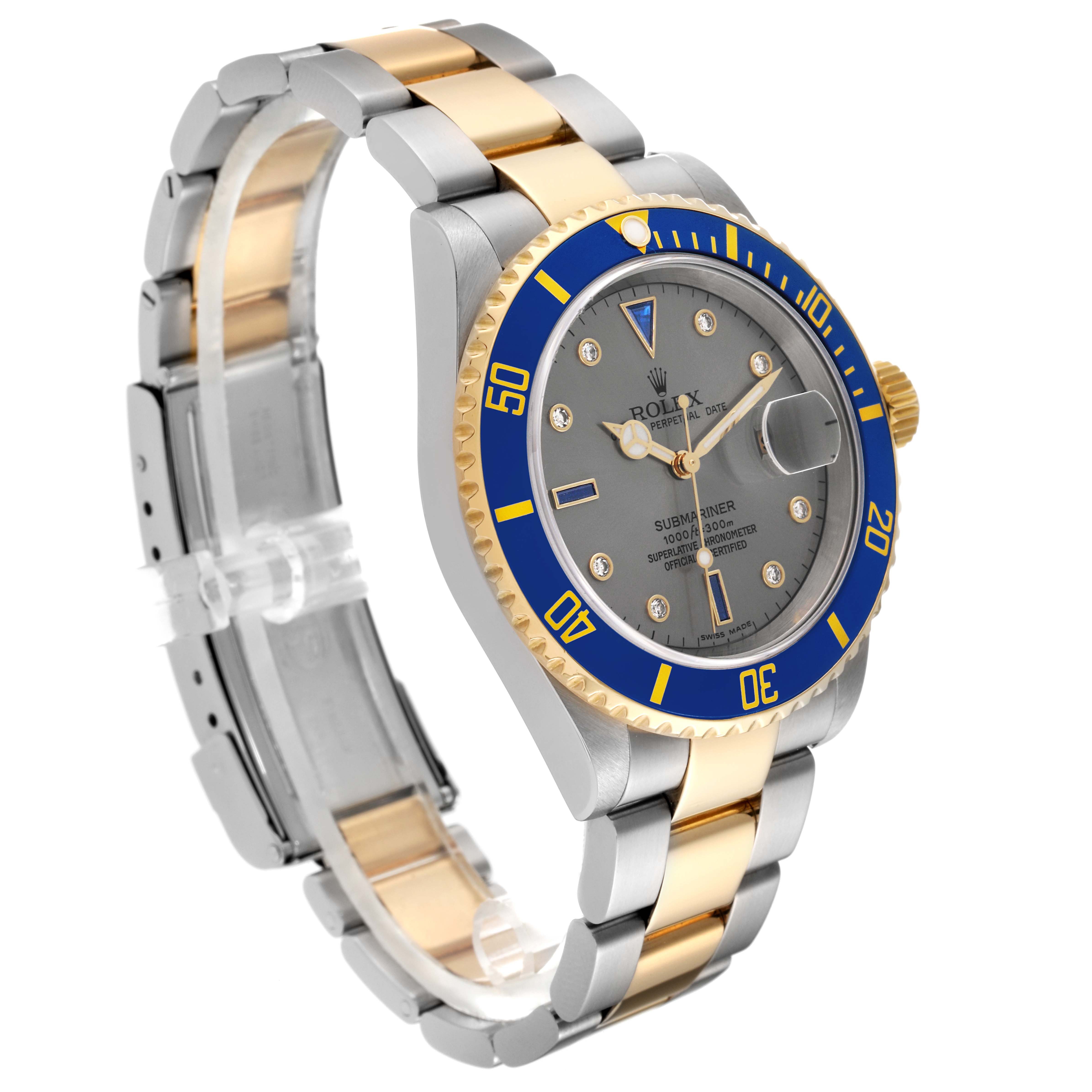 This is a side angle view of a Rolex Submariner 16613 Men's Steel and Gold (two tone) Grey Dial 16613 Men's Steel and Gold (two tone) Grey Dial watch, showing its blue bezel, gray dial, and two-tone metal bracelet.