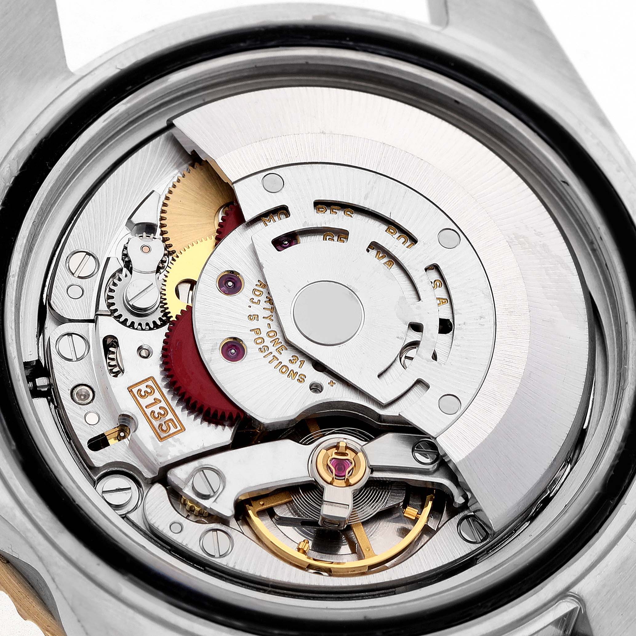The image shows the movement of a Rolex Submariner 16613 Men's Steel and Gold (two tone) Champagne Dial, highlighting gears, rotors, and other internal components from the back.