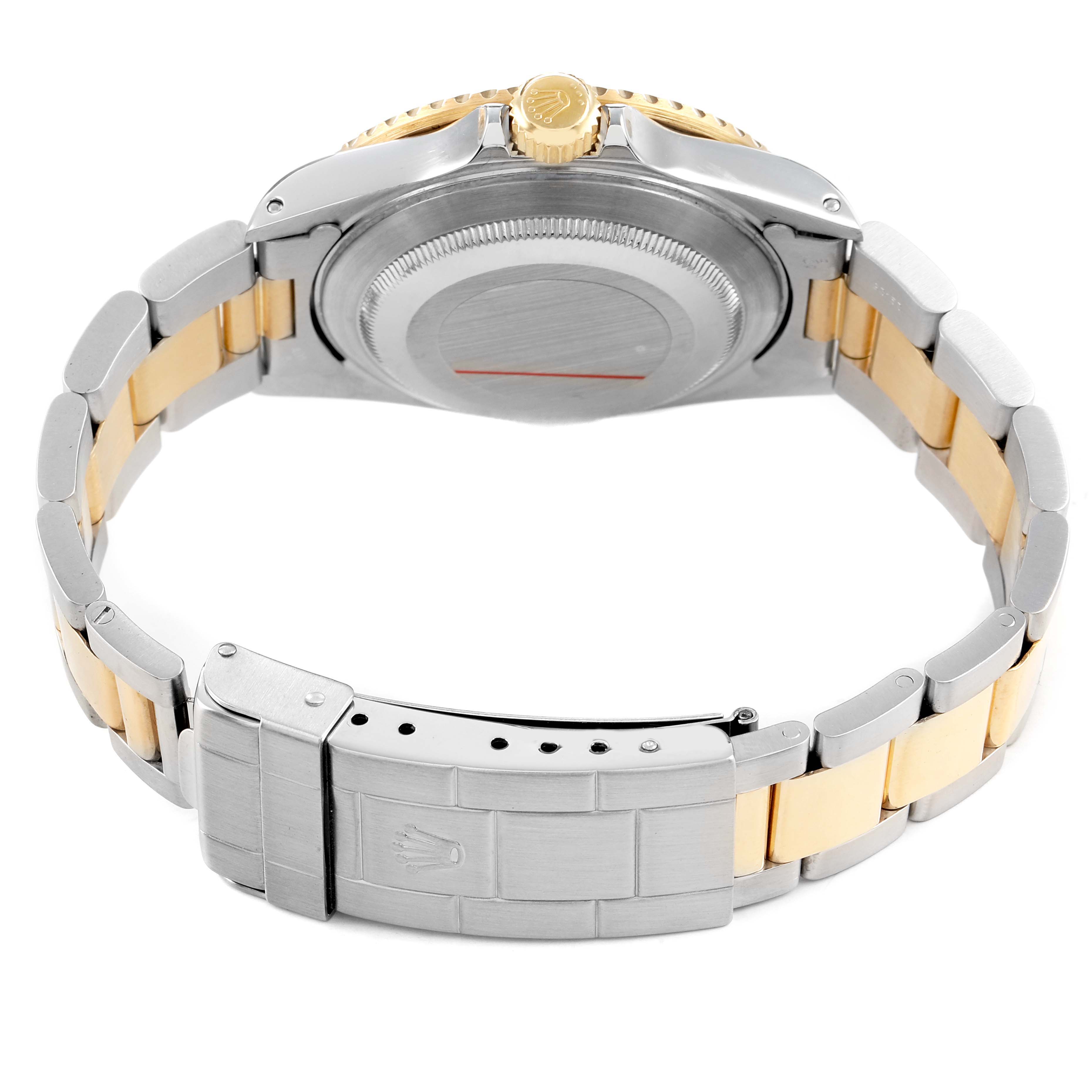 The image shows the back view of a Rolex Submariner 16613 Men's Steel and Gold (two tone) Champagne Dial, highlighting the bracelet, case back, and clasp.